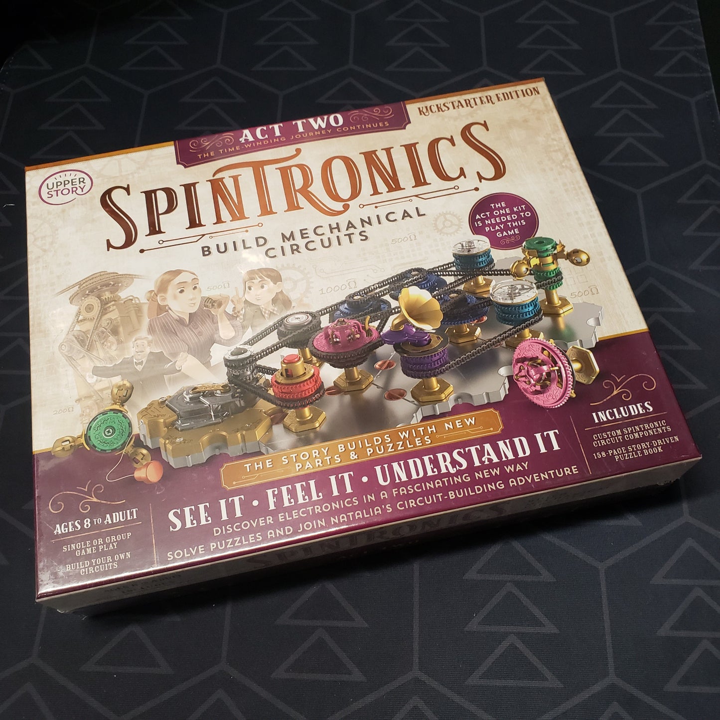 Image shows the front cover of the box of the Spintronics: Act Two STEM puzzle game