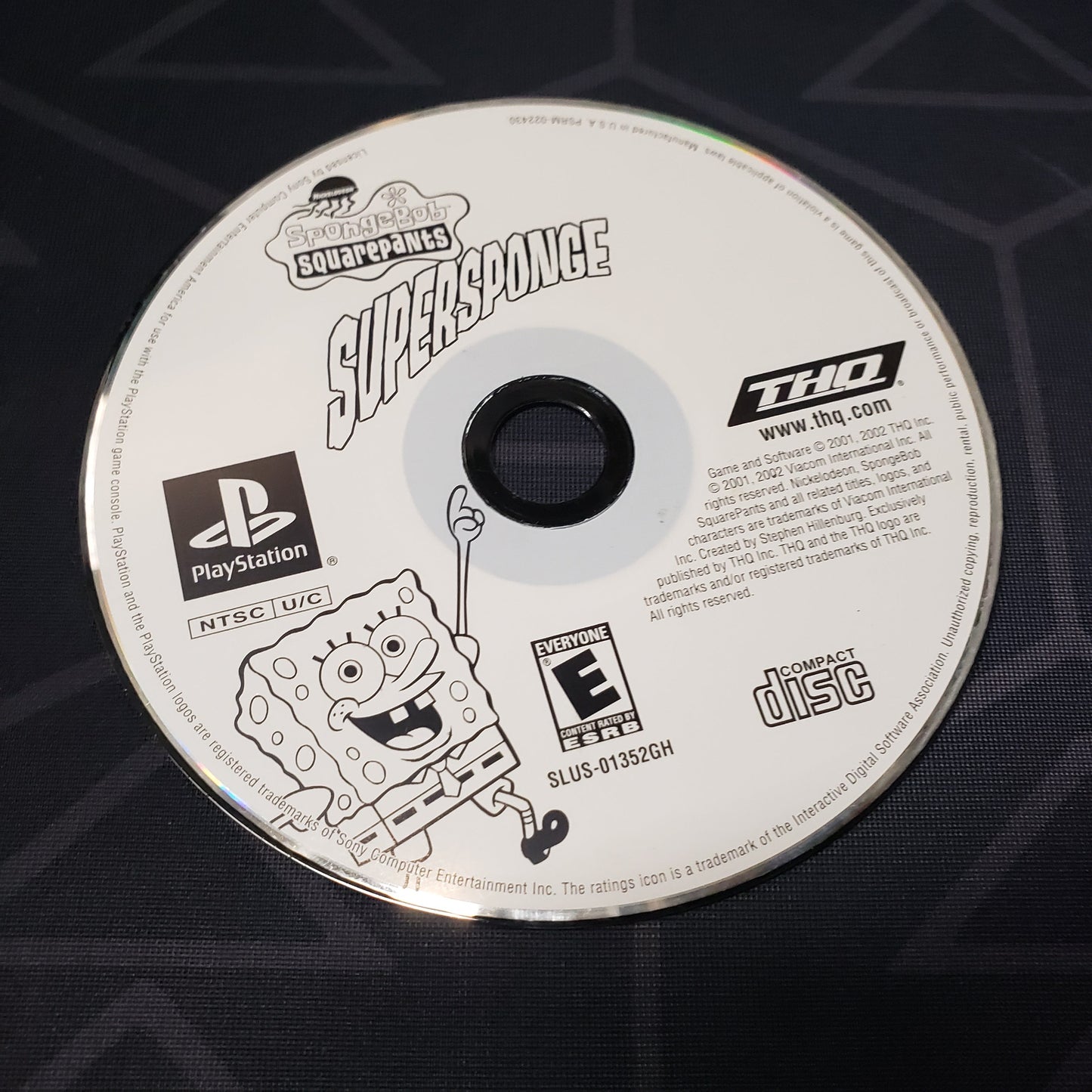 Image shows the label side of the game disc for the video game Spongebob Squarepants: Supersponge for Playstation 1