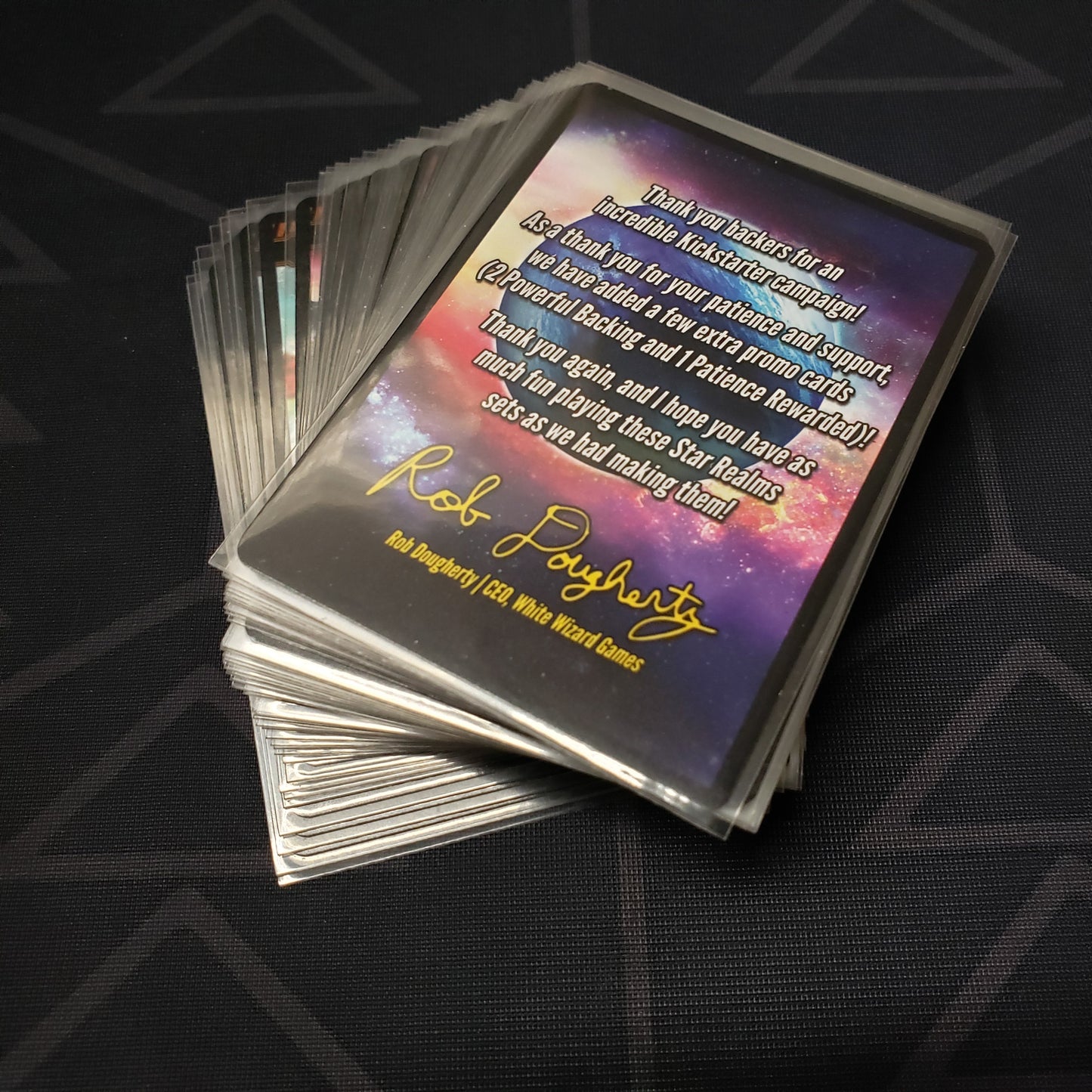 Image shows the fanned out cards for the Kickstarter Promo Pack for the Star Realms: Frontiers card game
