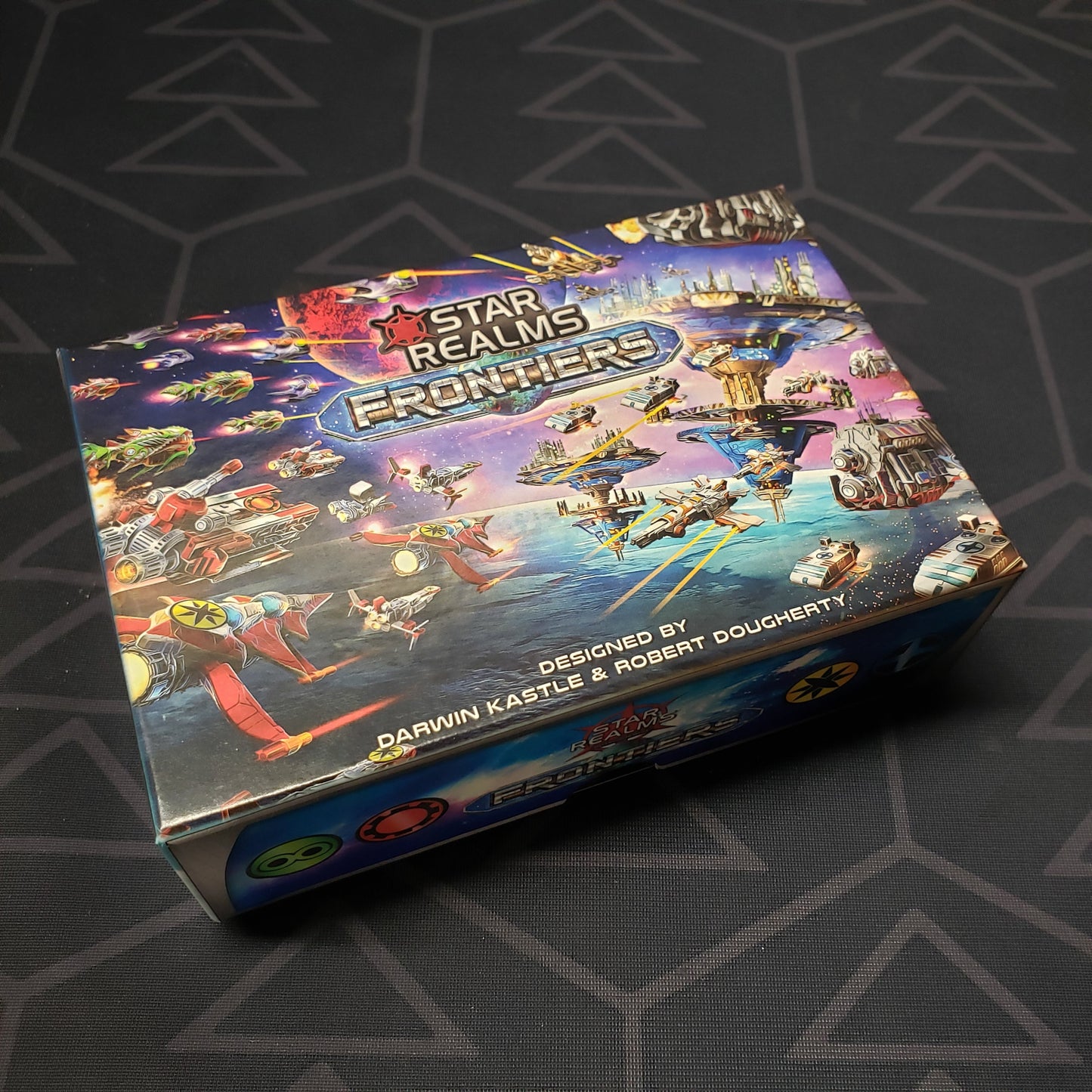 Image shows the front cover of the box of the card game Star Realms: Frontiers