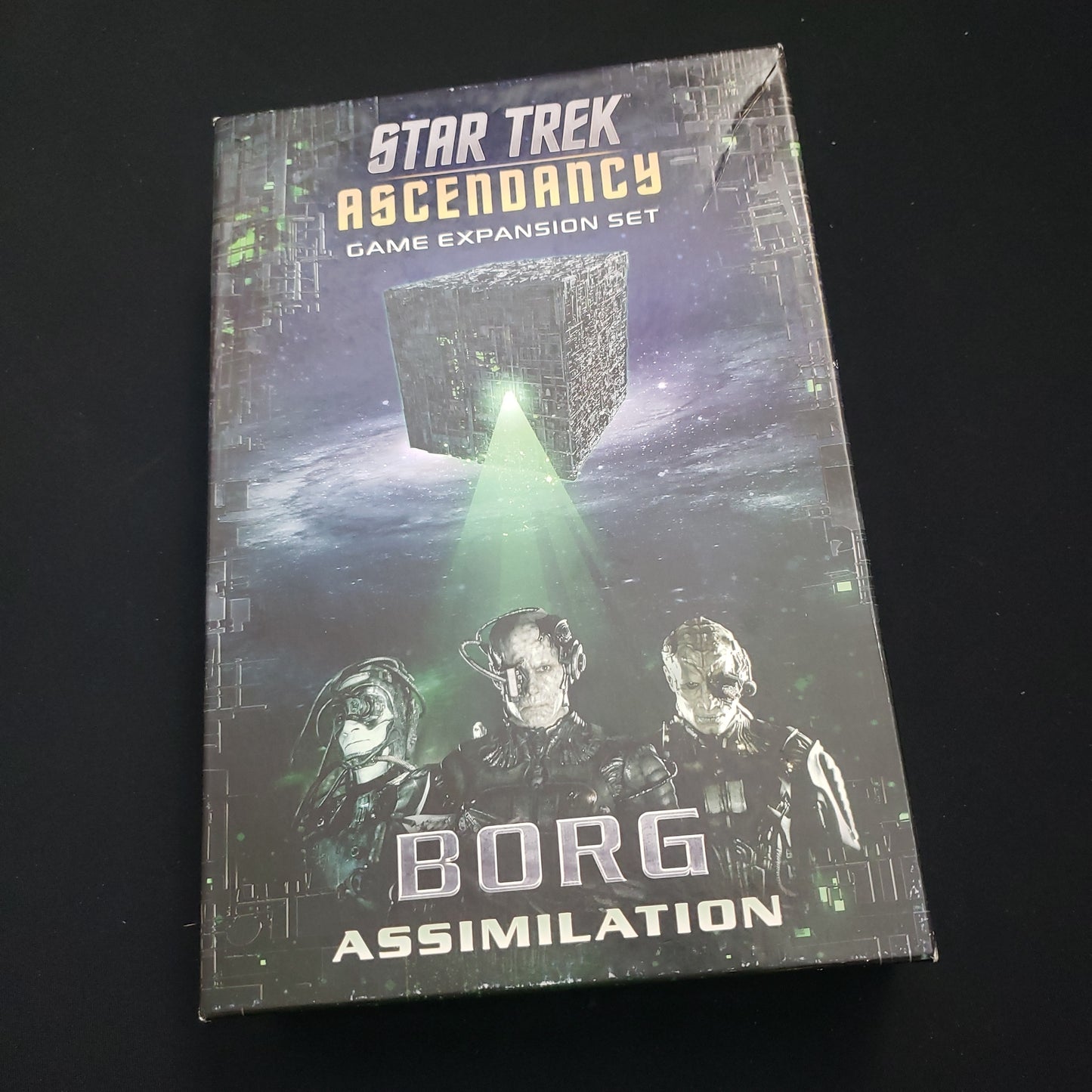 Image shows the front cover of the box of the Borg Assimilation expansion for the board game Star Trek: Ascendancy