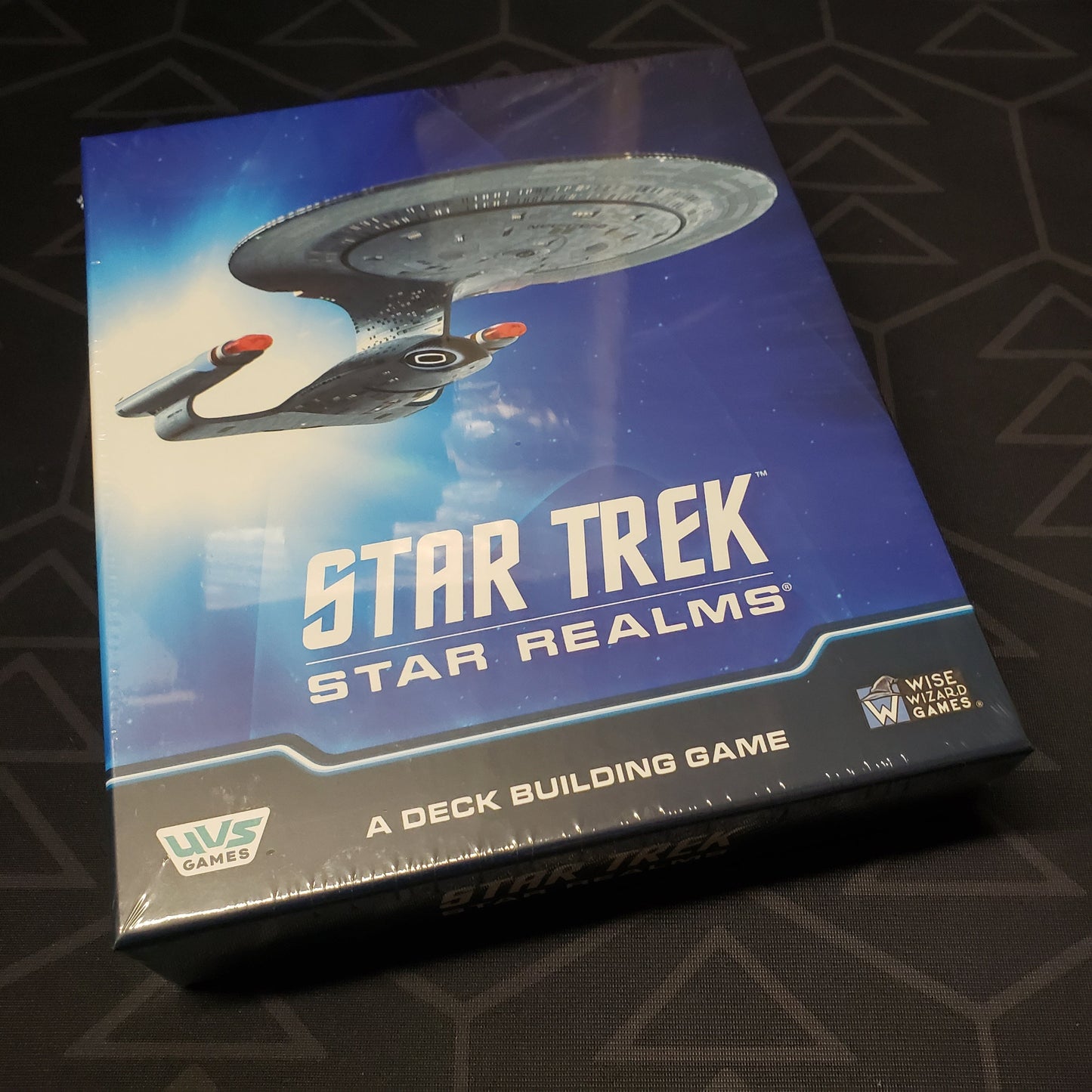 Image shows the front cover of the box of the Star Trek: Star Realms card game