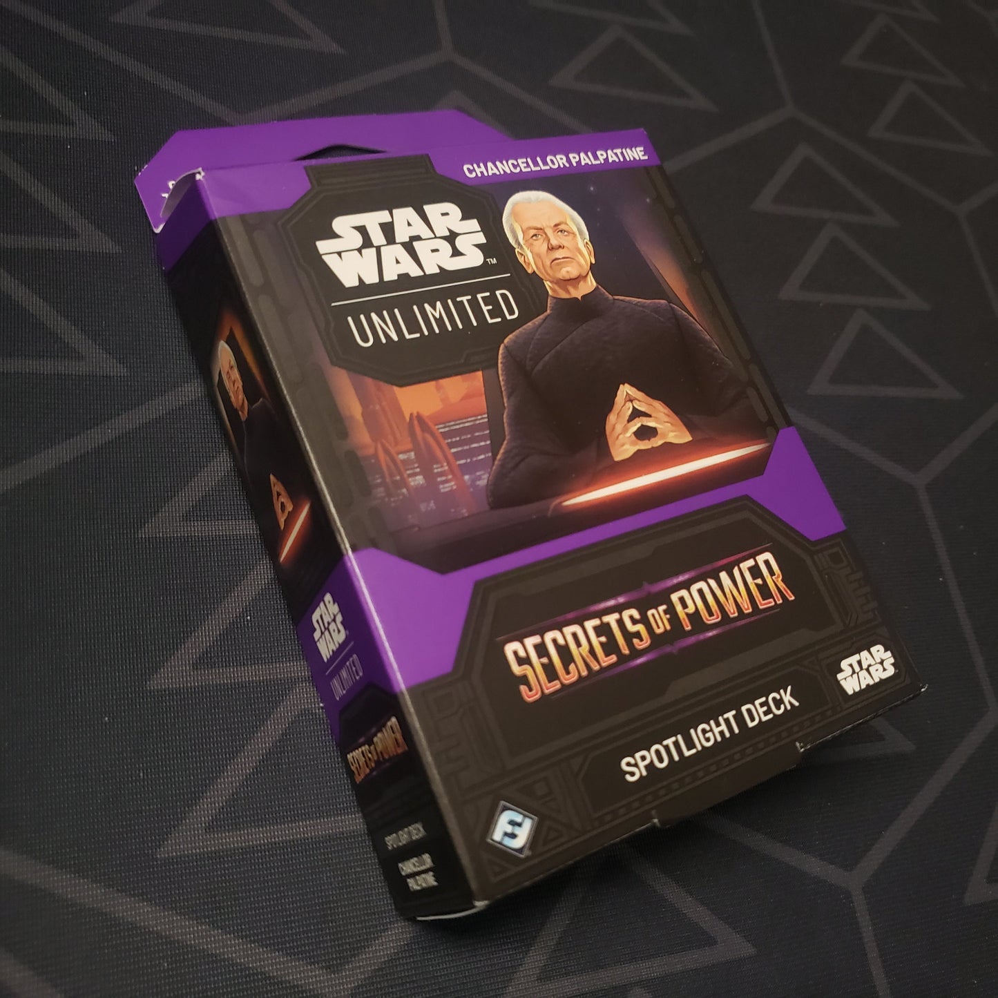 Image shows the front cover of the box of the Secrets of Power Spotlight Deck: Chancellor Palpatine for the card game Star Wars Unlimited