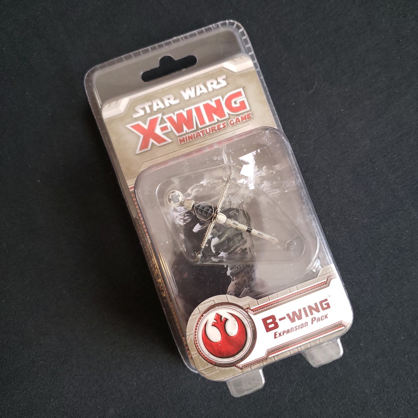Image shows the front cover of the package of the B-Wing expansion for the Star Wars: X-Wing miniatures game