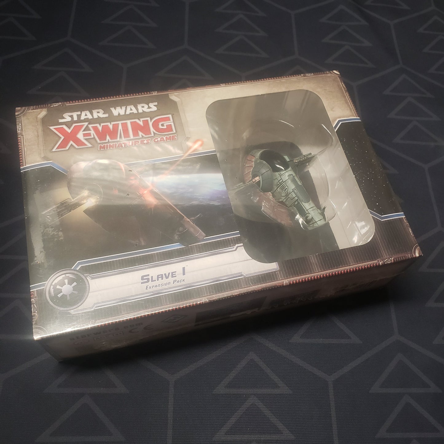 Image shows the front of the box of the first edition Slave I expansion pack for the miniatures game Star Wars: X-Wing