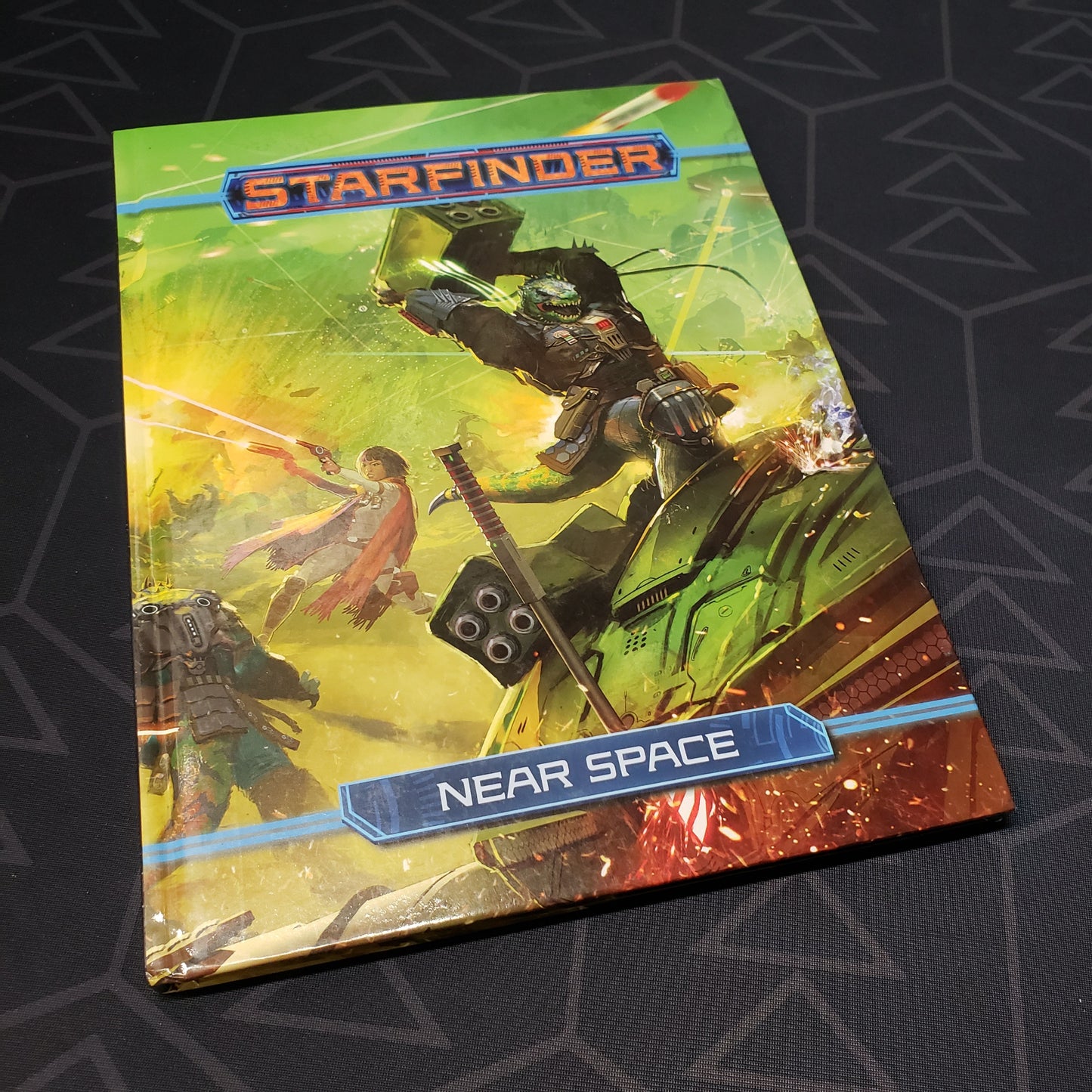 Image shows the front cover of the Near Space book for the roleplaying game Starfinder 1E