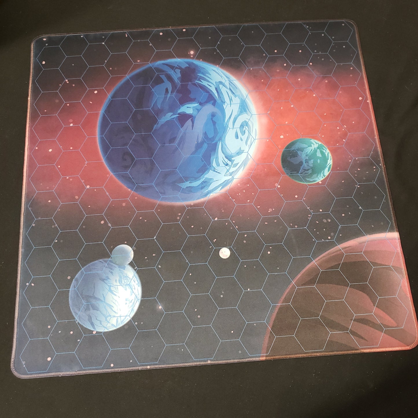 Image shows the playmat for the board game Stars of Akarios