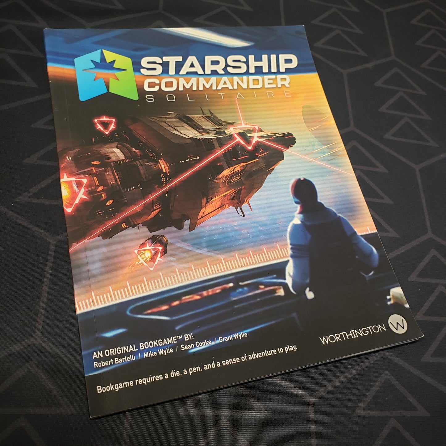 Image shows the front cover of the Starship Commander Solitaire wargaming book