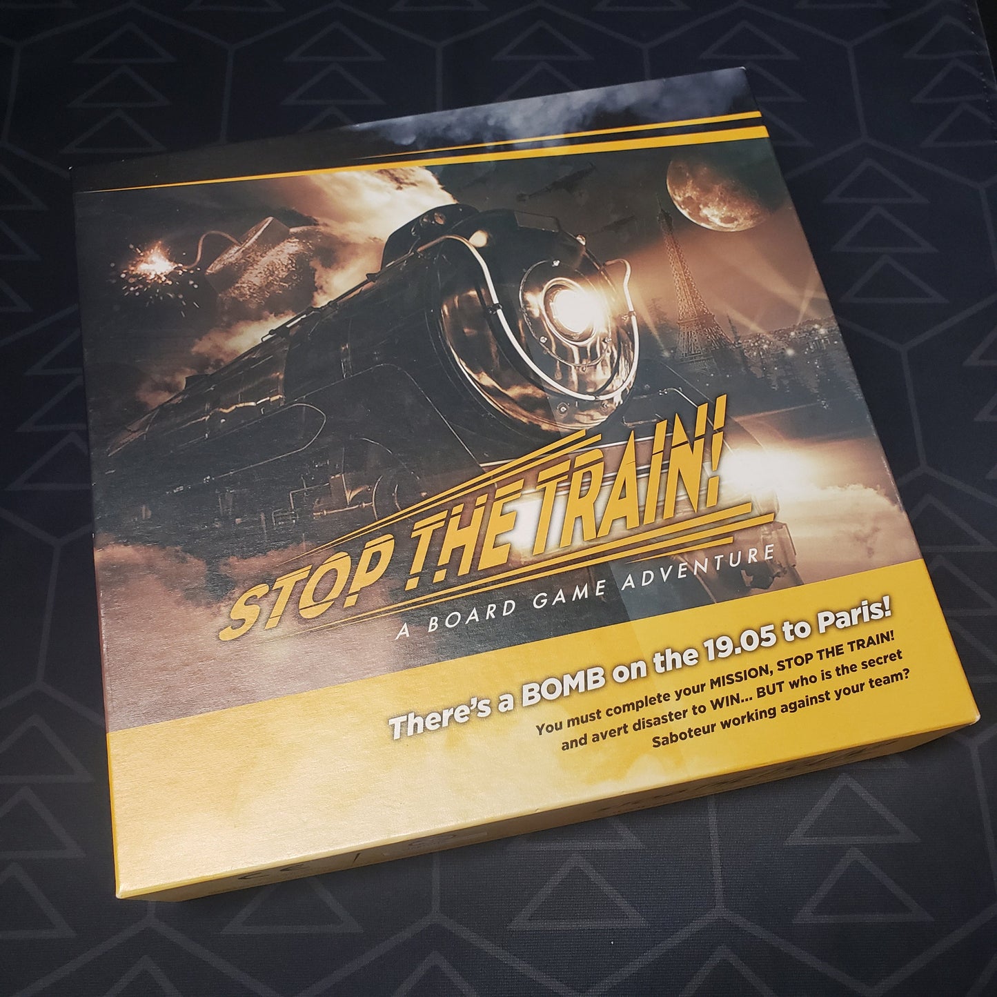 Image shows the front cover of the box of the Stop the Train! board game