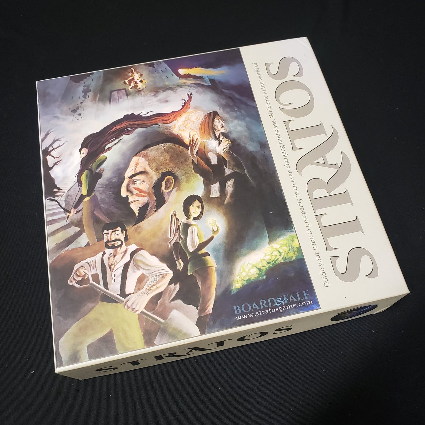 Image shows the front cover of the box of the Stratos board game