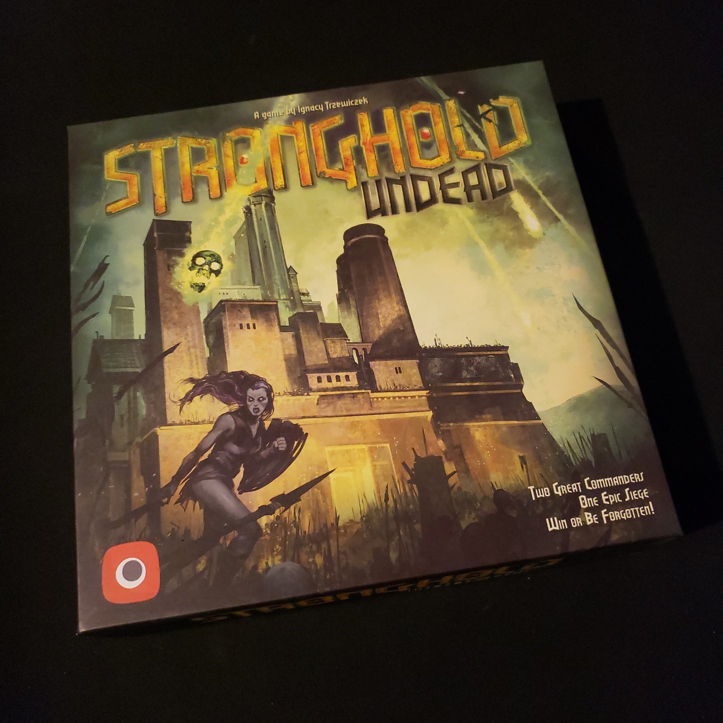 Image shows the front cover of the box of the Stronghold: Undead board game