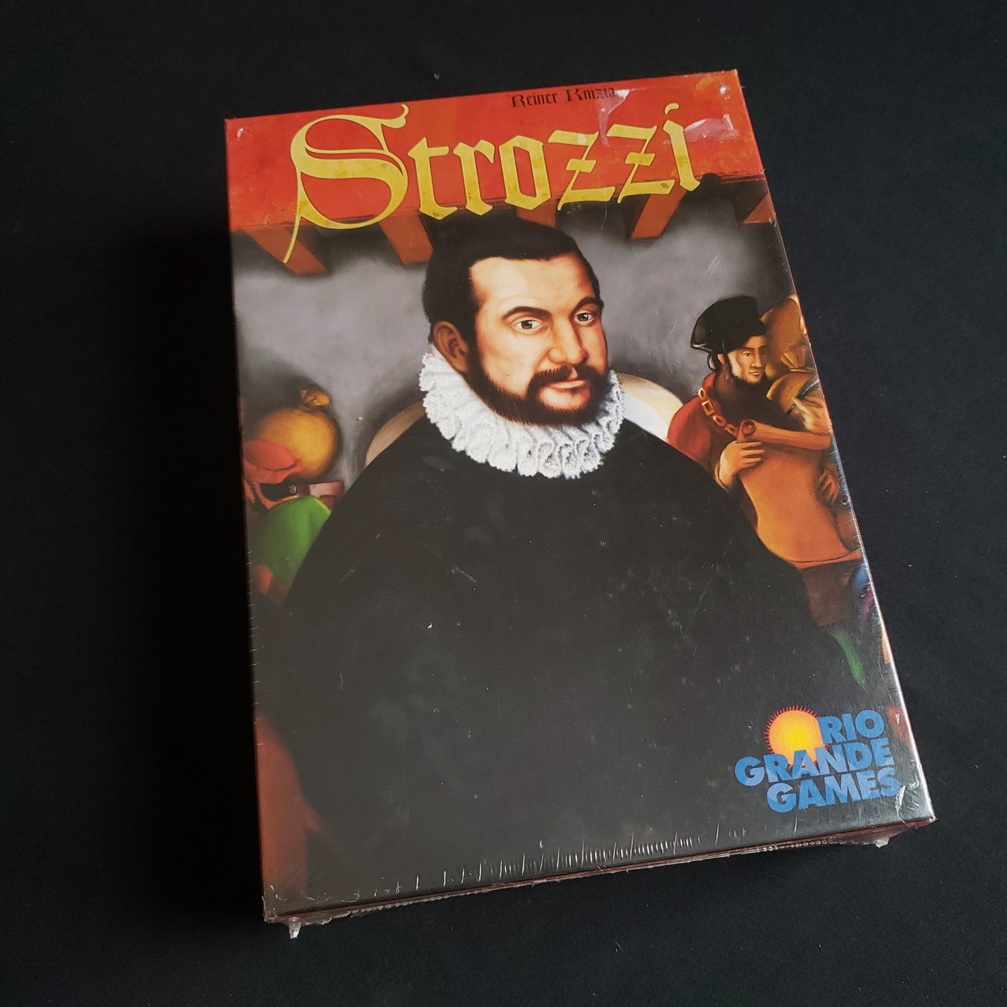 Image shows the front cover of the box of the Strozzi board game
