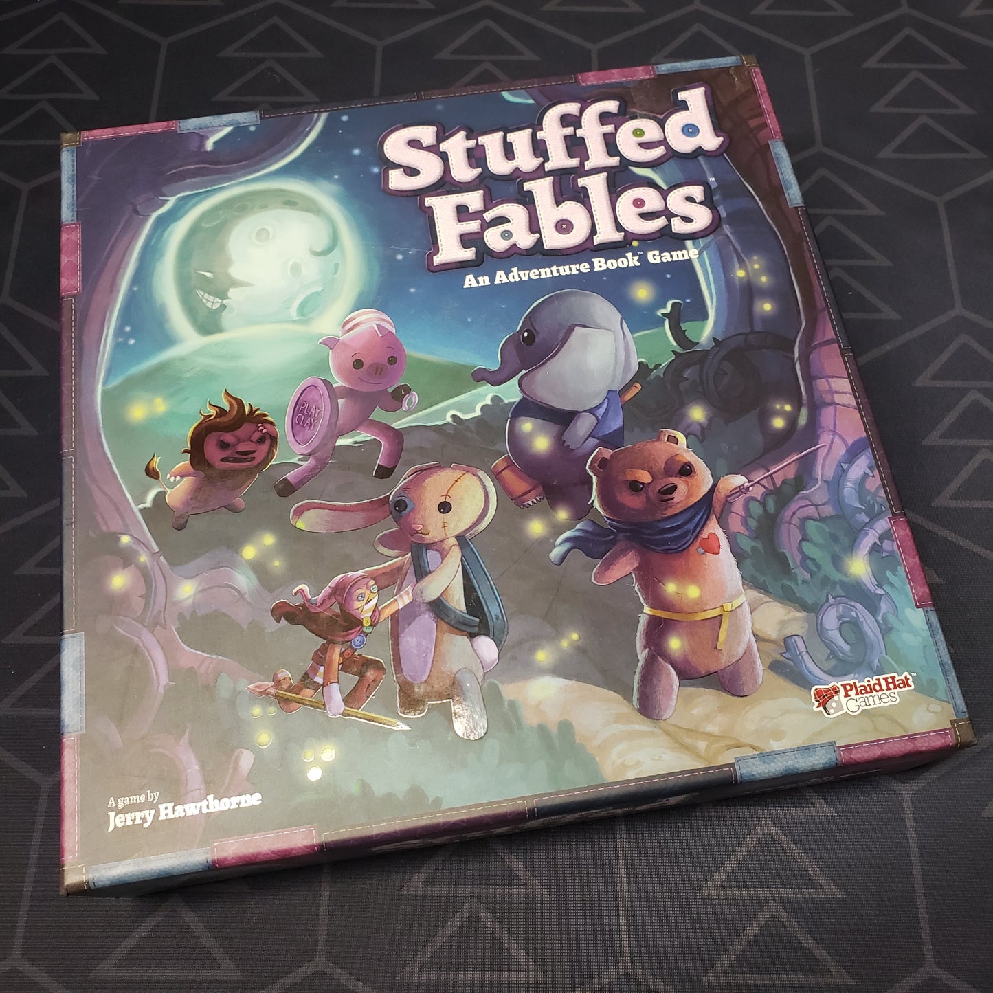 Image shows the front cover of the box of the Stuffed Fables board game