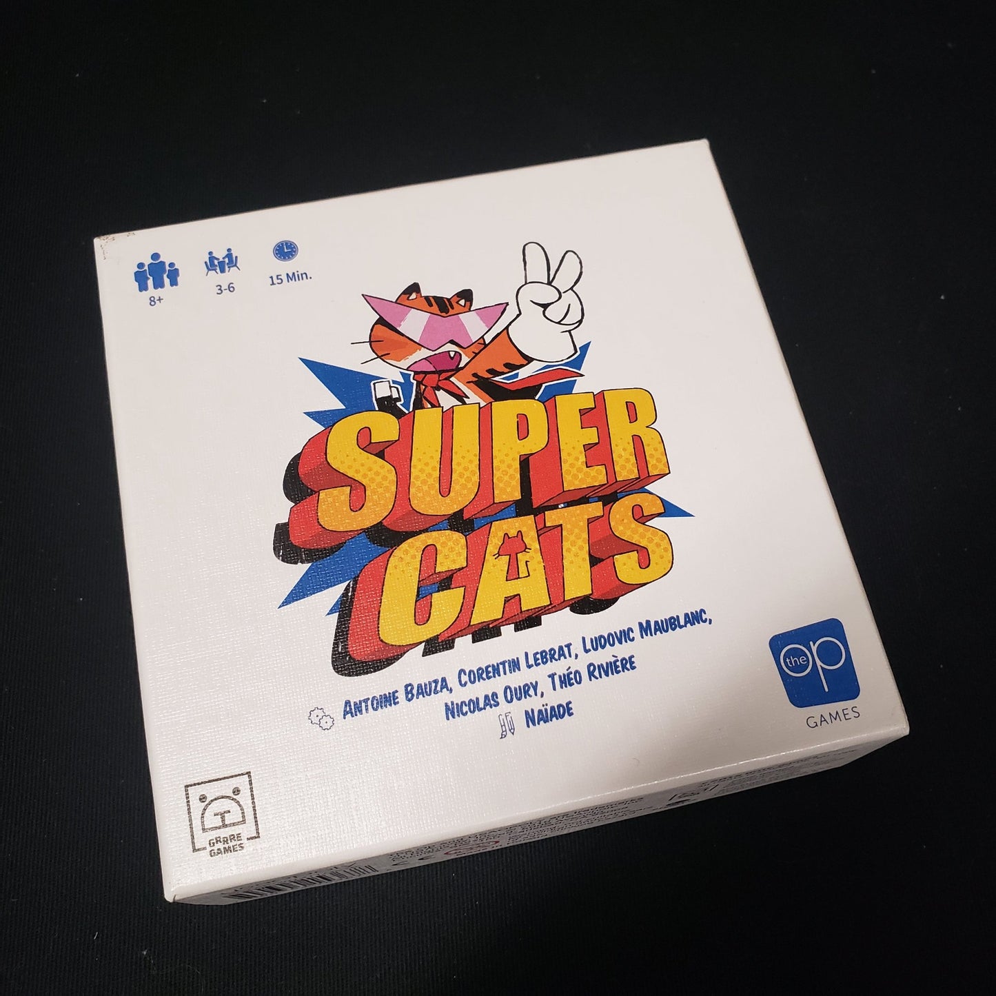 Image shows the front cover of the box of the Super Cats board game