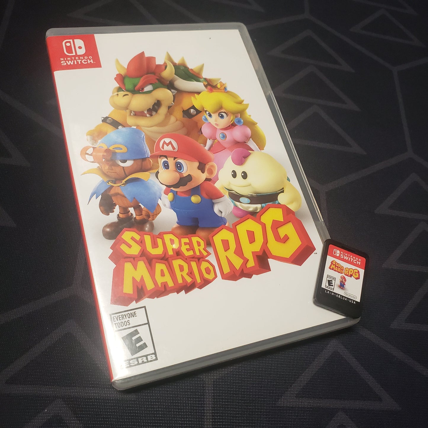 Image shows the case and cartridge for the video game Super Mario RPG for Nintendo Switch
