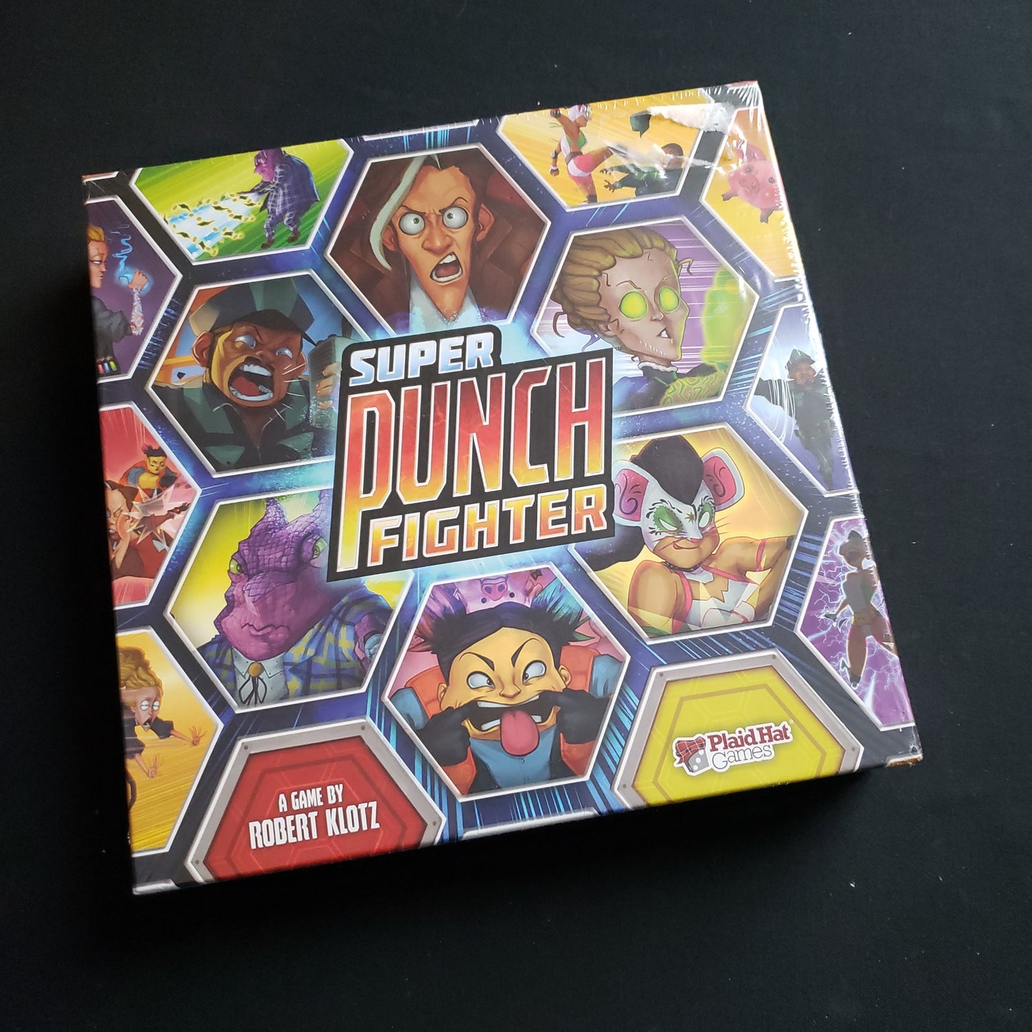 Image shows the front cover of the box of the Super Punch Fighter board game