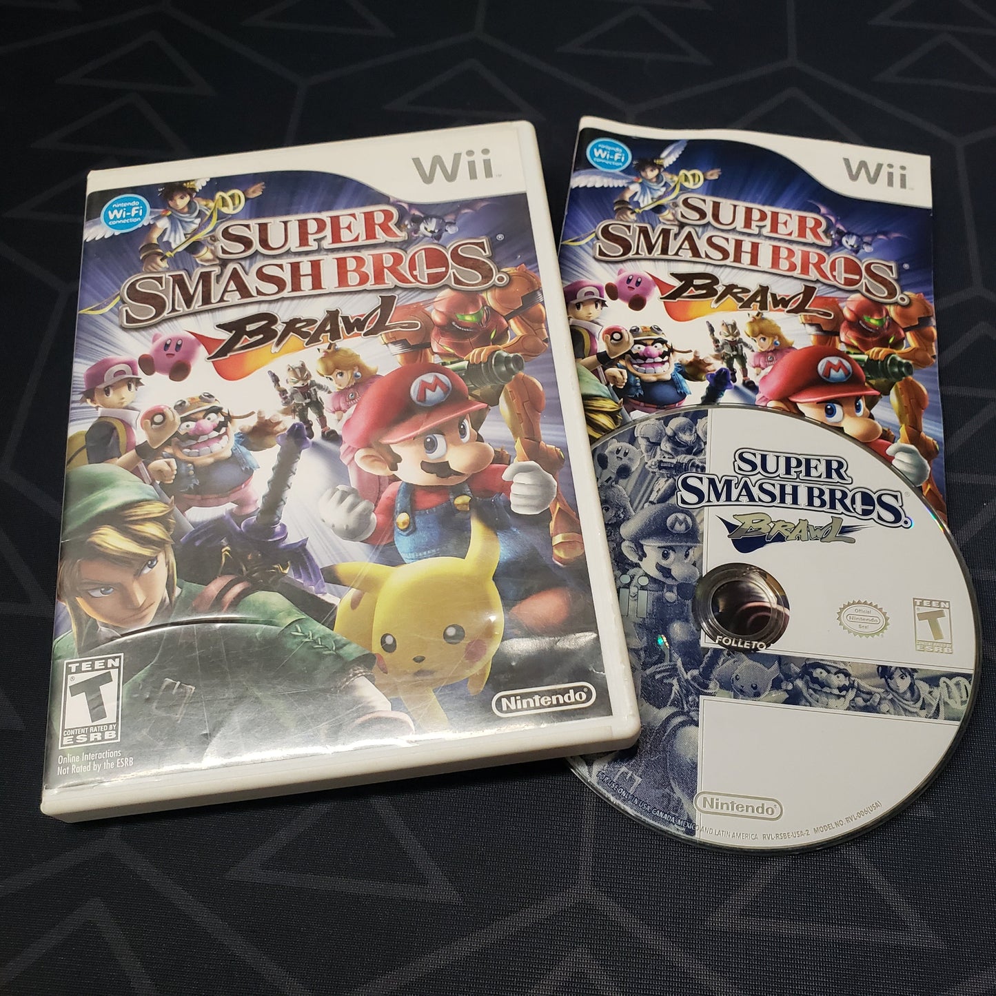 Image shows the case, manual & disc for the video game Super Smash Bros. Brawl for Nintendo Wii