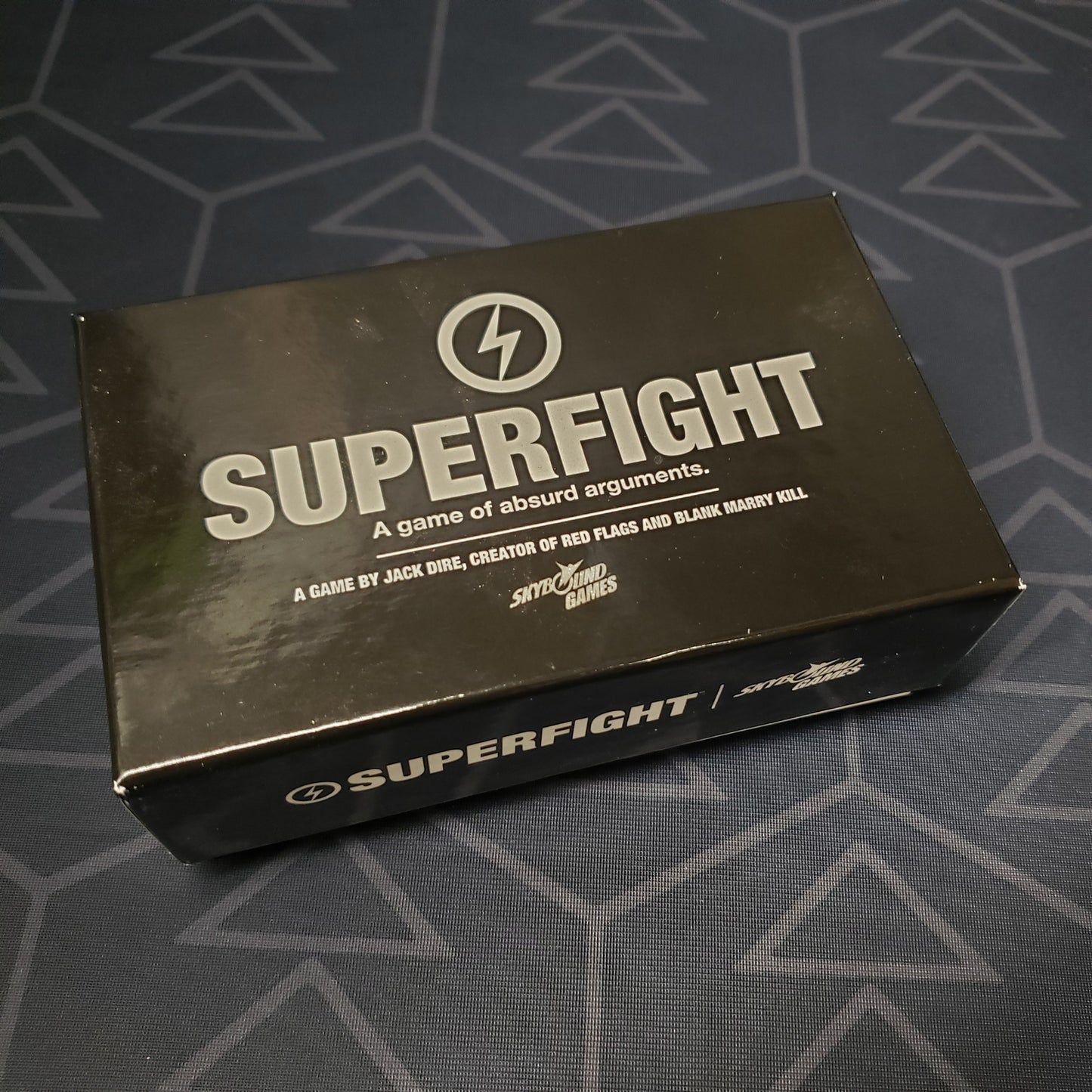 Image shows the front of the box of the Superfight card game