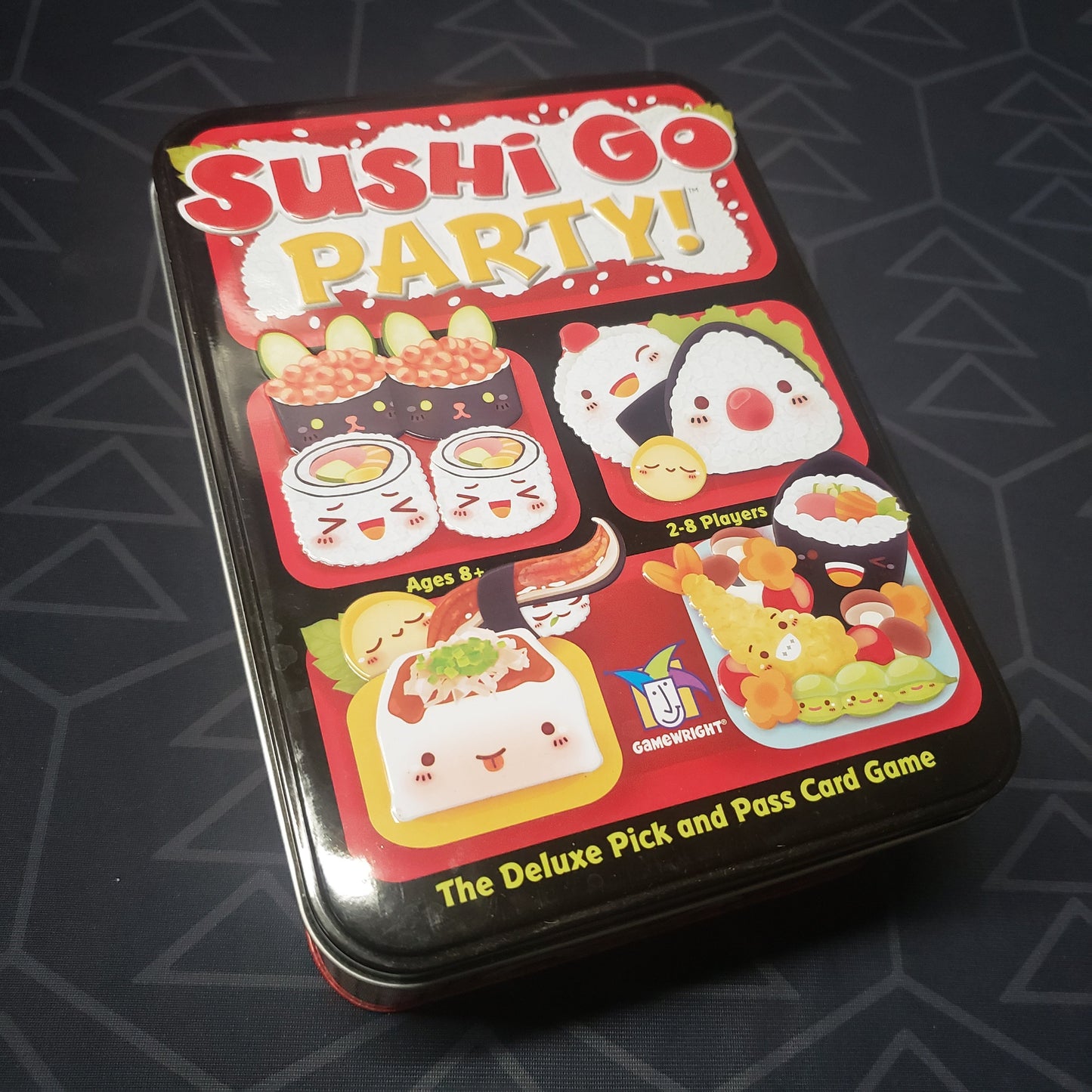 Image shows the front cover of the box of the Sushi Go Party! card game