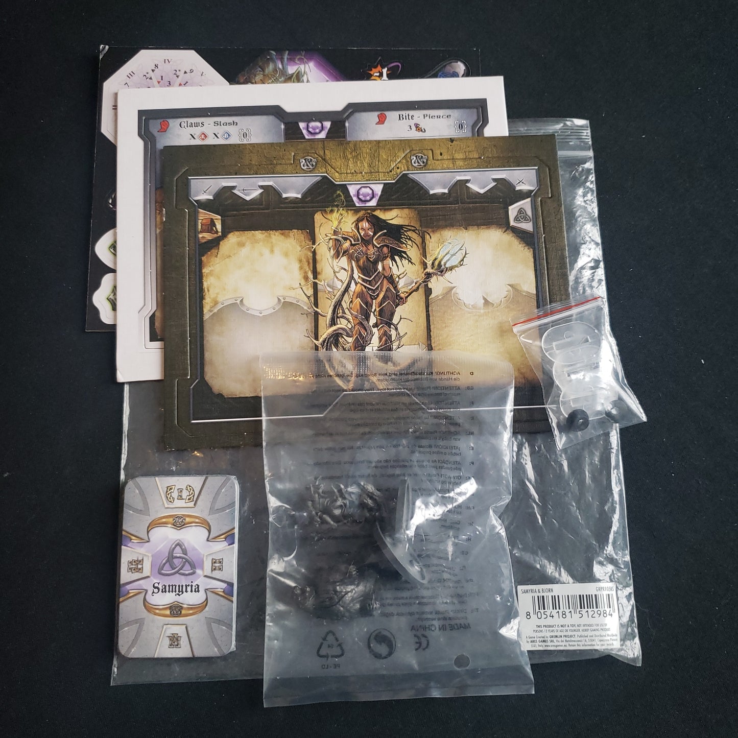 Image shows the miniatures, punchboards and cards for the Samyria character expansion for the board game Sword & Sorcery: Ancient Chronicles