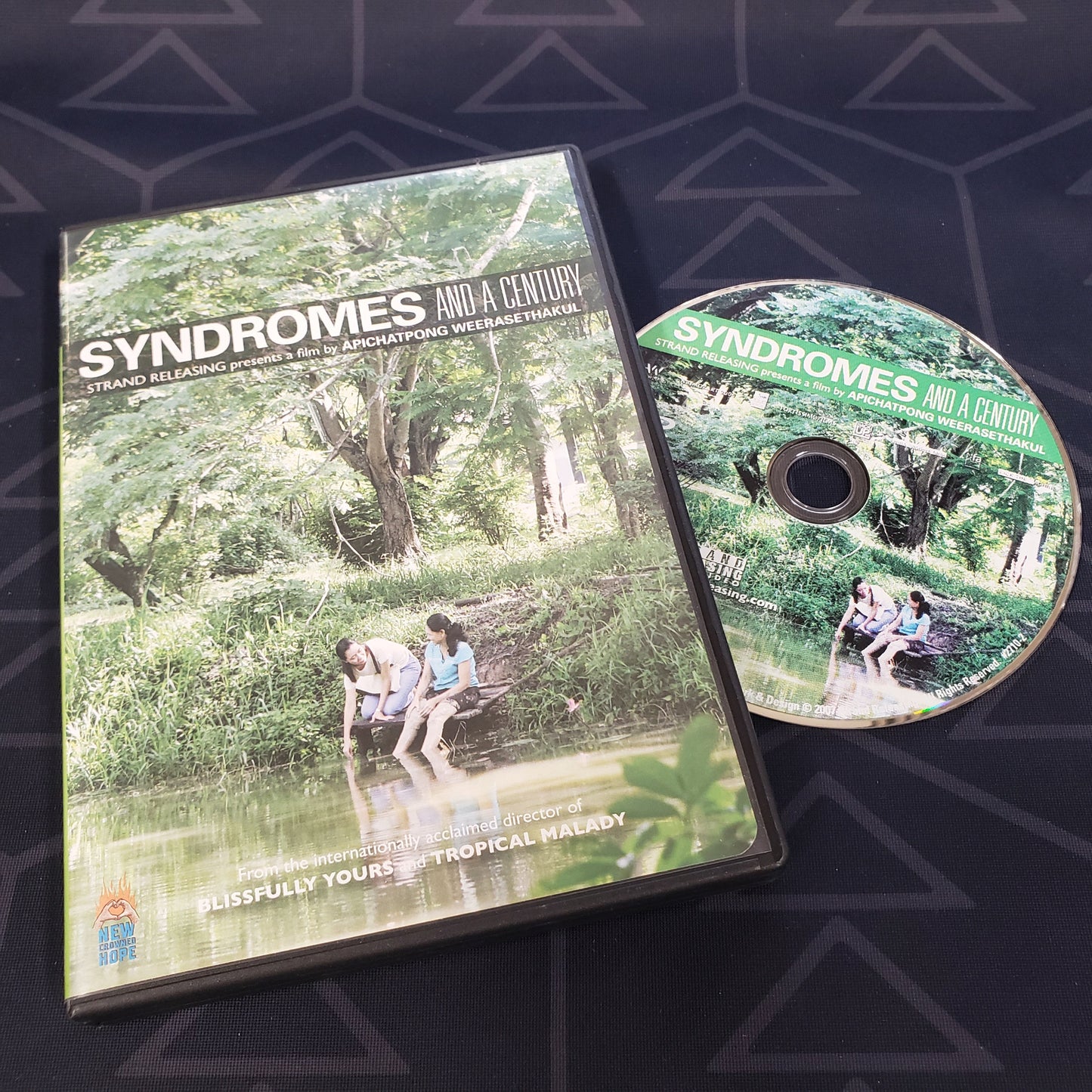 Image shows the case & disc for the documentary film Syndromes and a Century on DVD