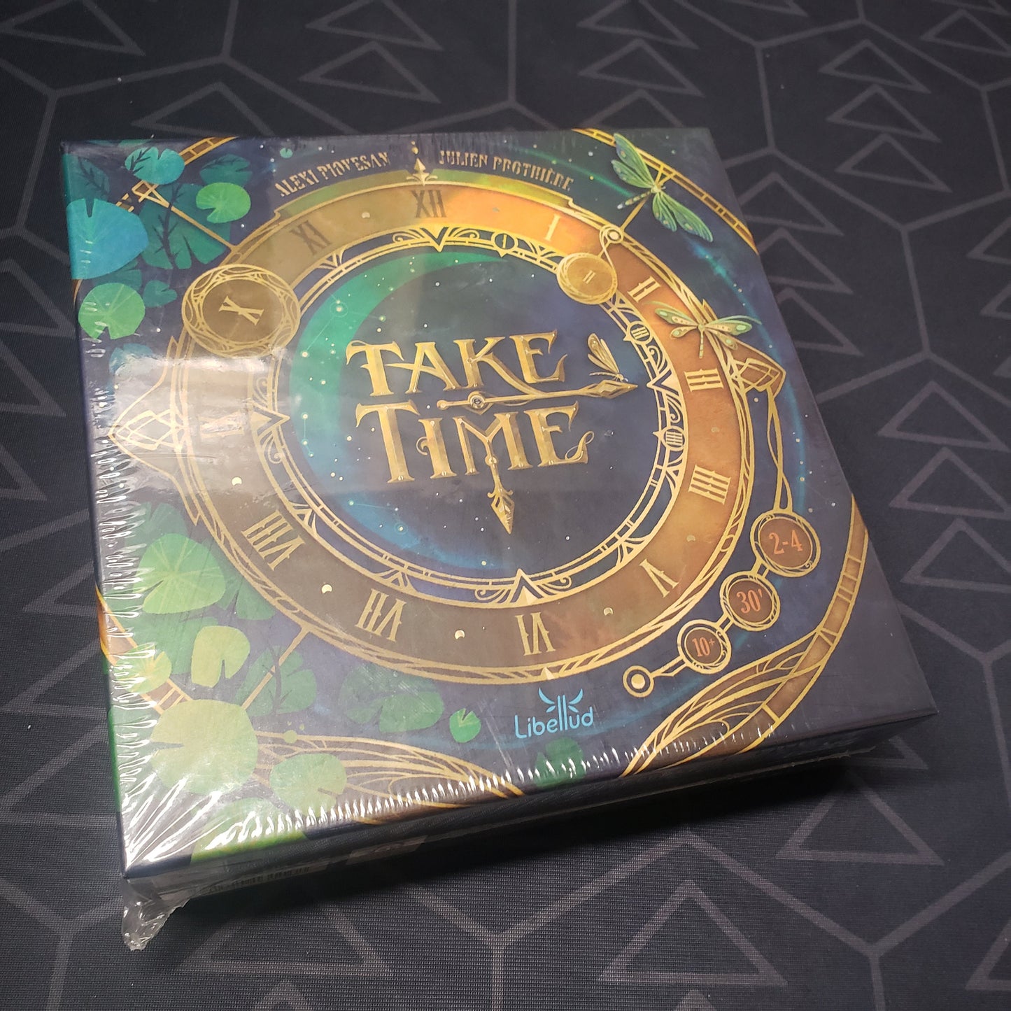 Image shows the front cover of the box for the Take Time board game