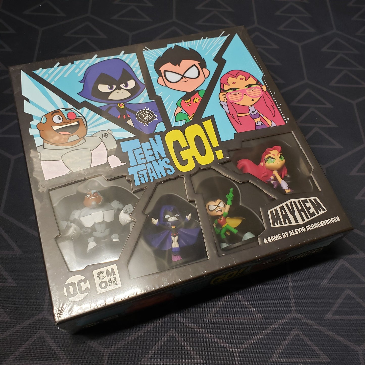Image shows the front cover of the box for the Teen Titans GO! Mayhem board game