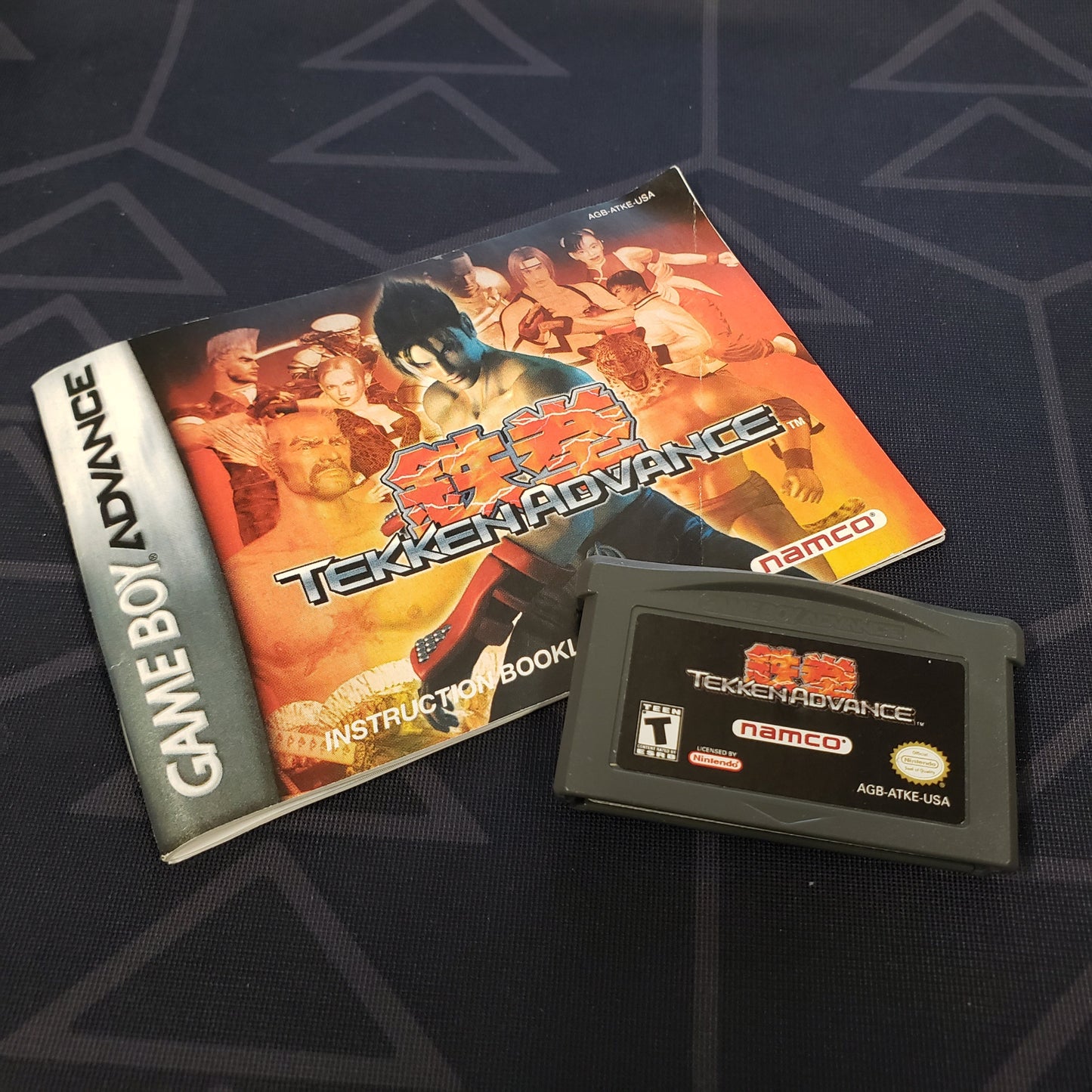 Image shows the manual & cartridge for the video game Tekken Advance for Nintendo Game Boy Advance