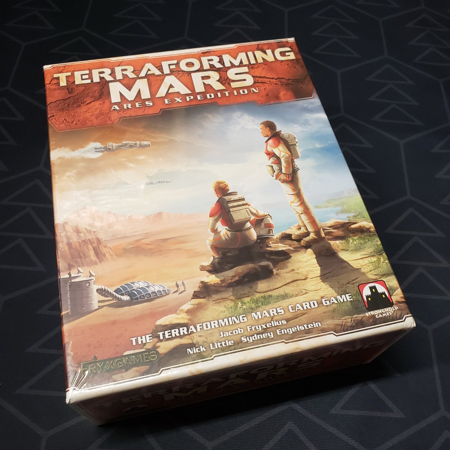 Image shows the front cover of the box of the Terraforming Mars: Ares Expedition card game