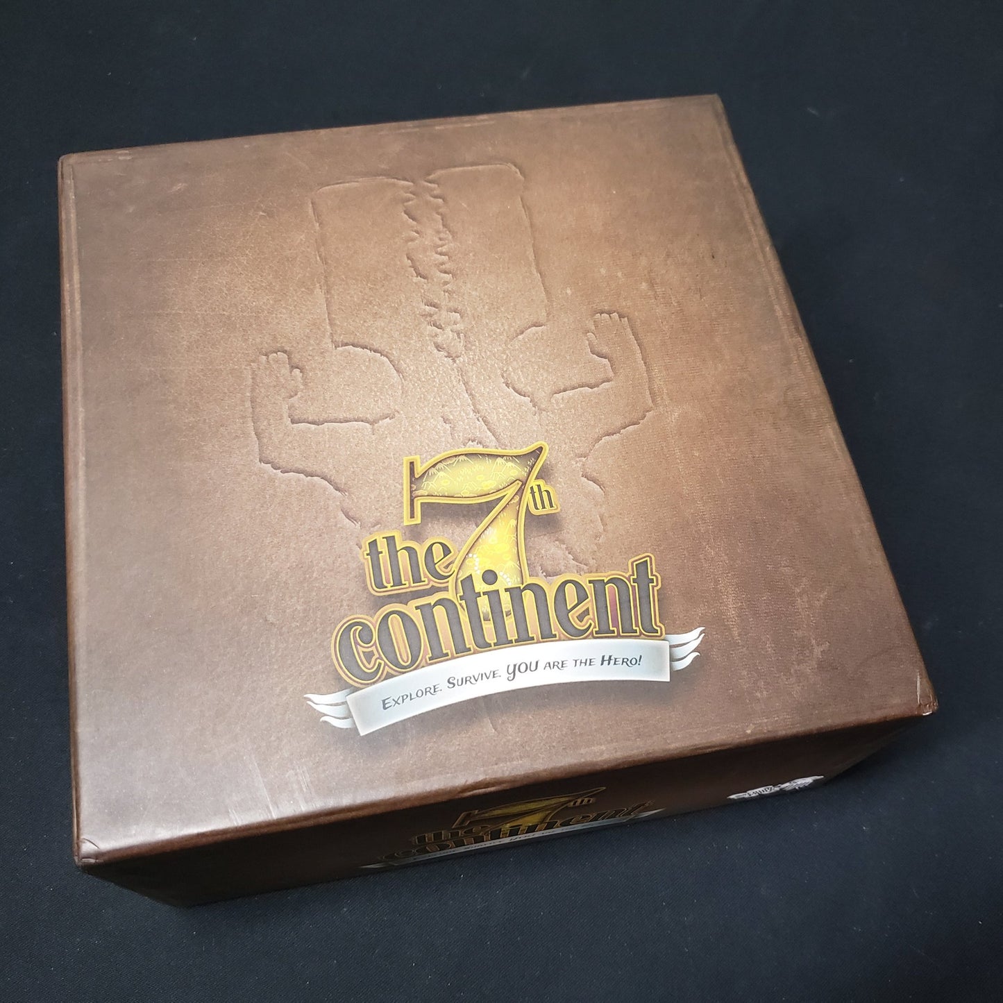 Image shows the front cover of the box of the board game 7th Continent: Classic Edition