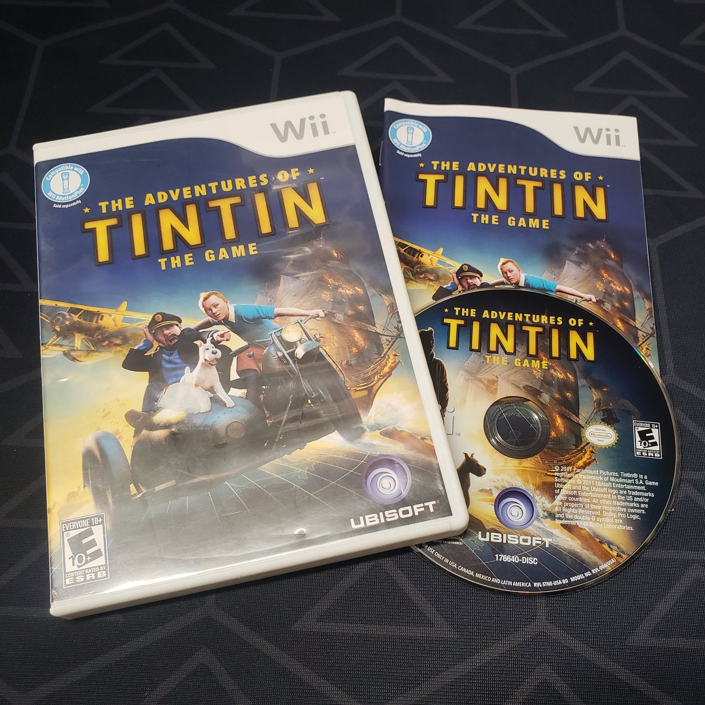 Image shows the case, manual & disc for the video game The Adventures of Tintin for Nintendo Wii
