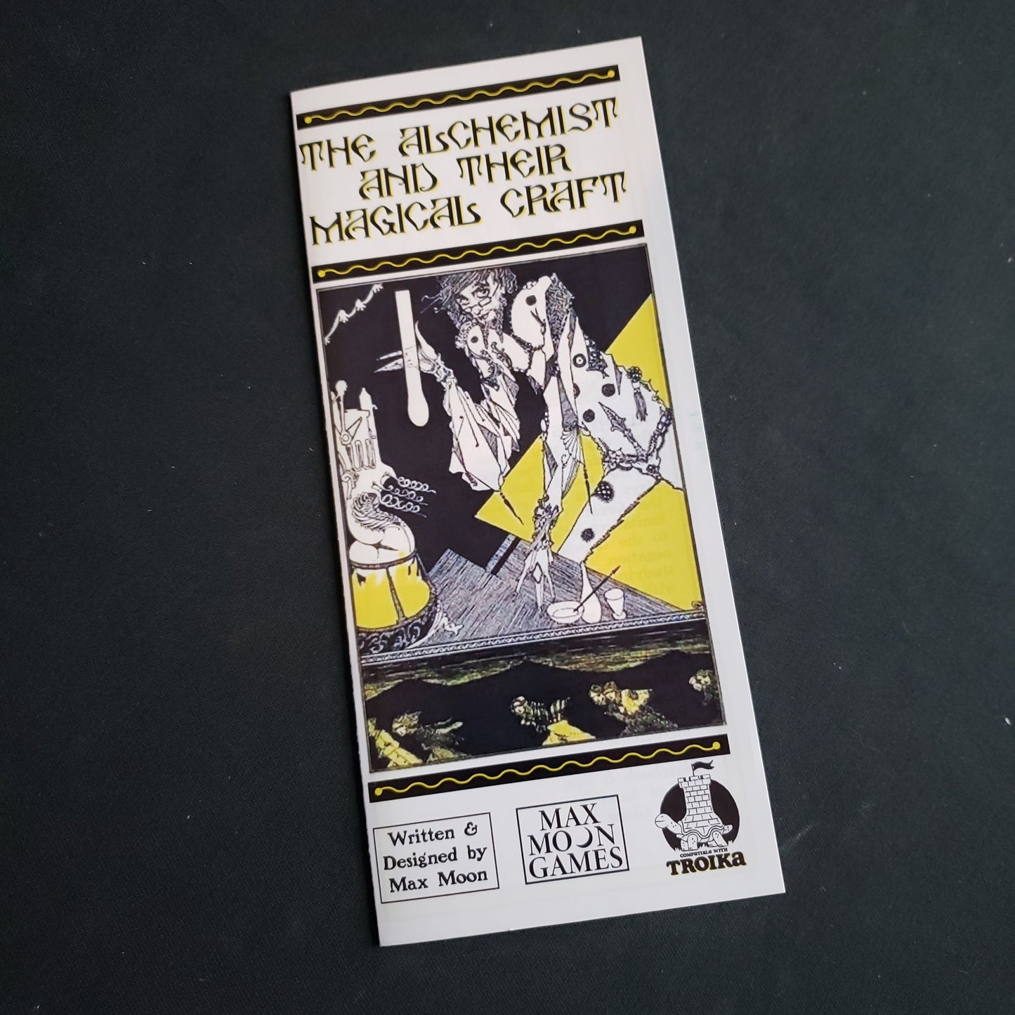 Image shows the front of the Alchemist and Their Magical Craft supplement for the Troika! roleplaying game