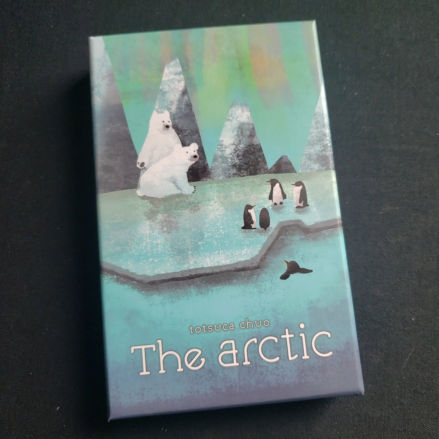 Image shows the front cover of the box of the Arctic board game