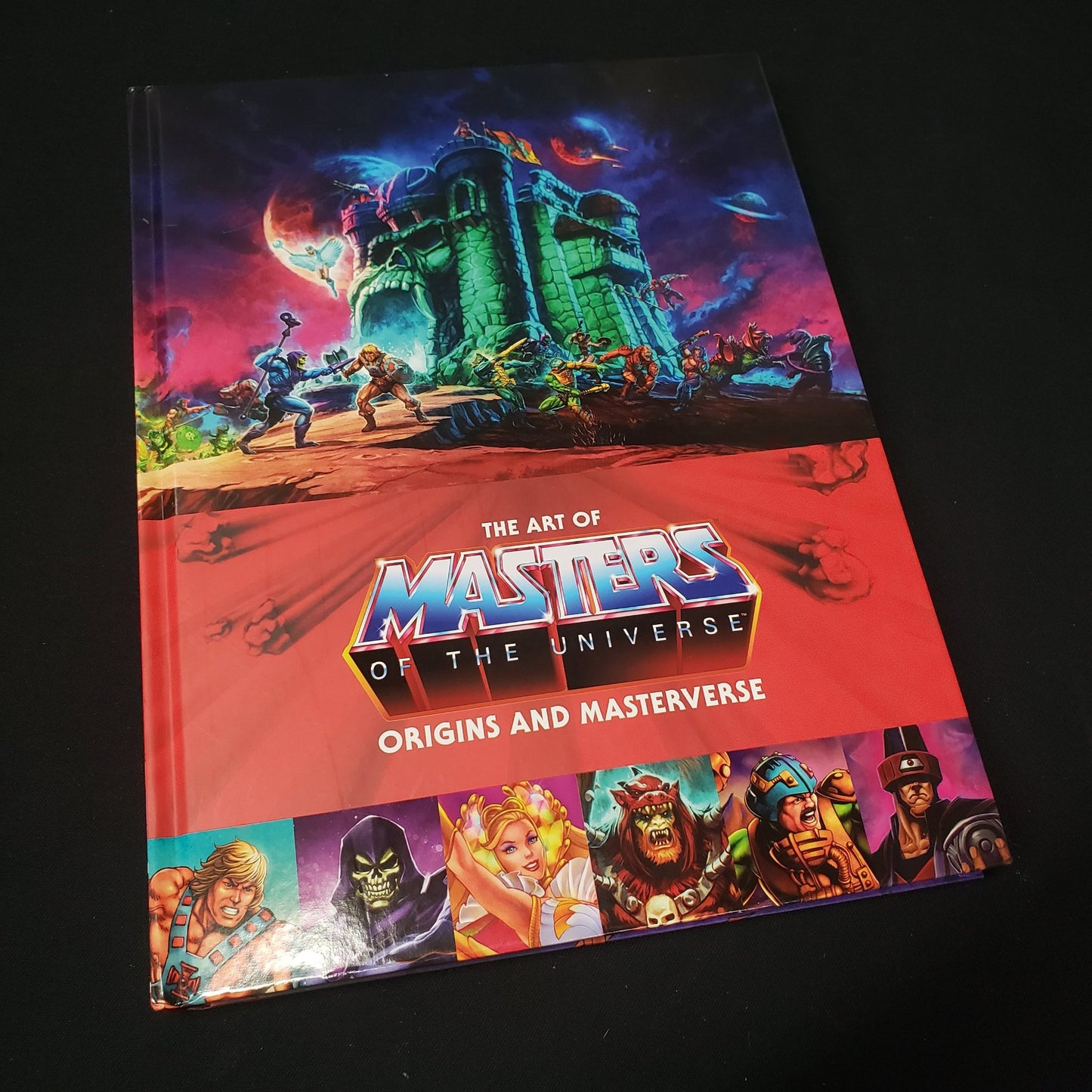 Image shows the front cover of the Art of Masters of the Universe: Origins and Masterverse art book