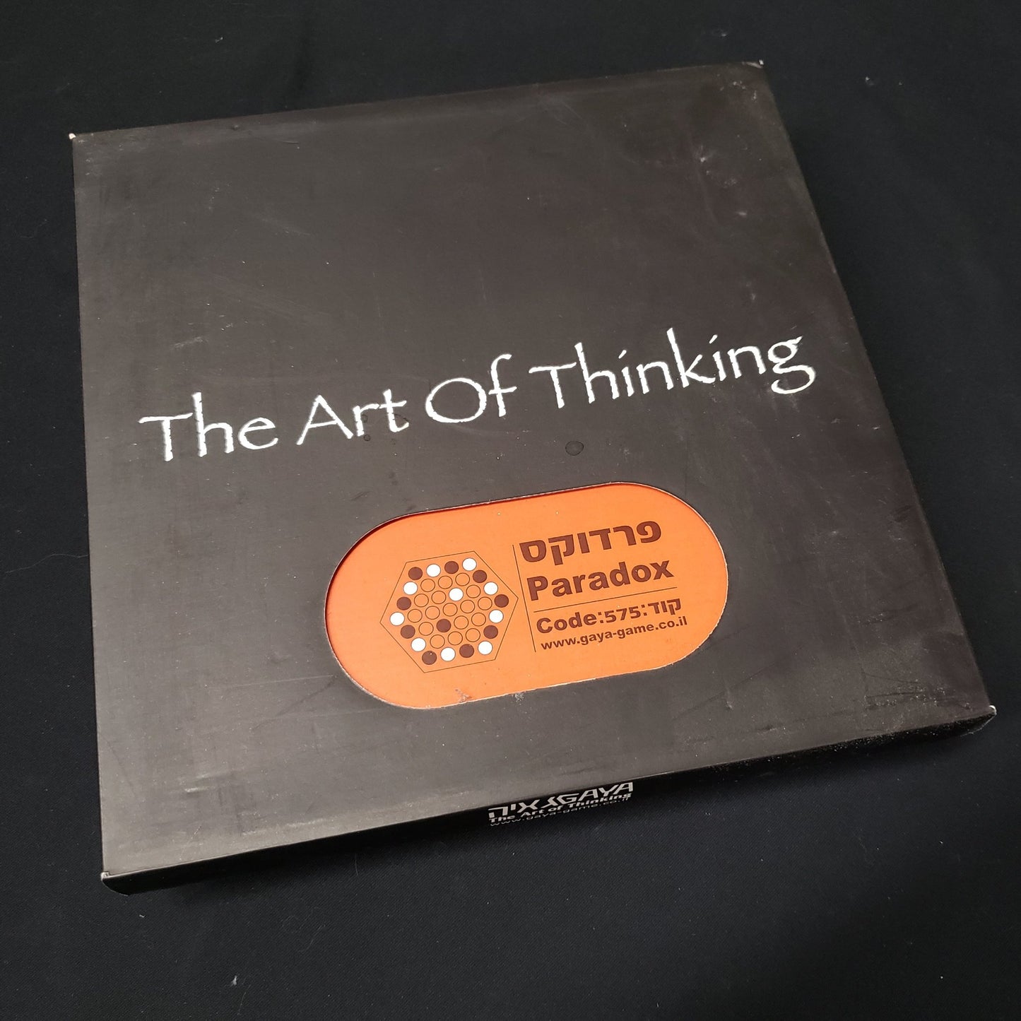 Image shows the front cover of the box of the Art of Thinking: Paradox board game
