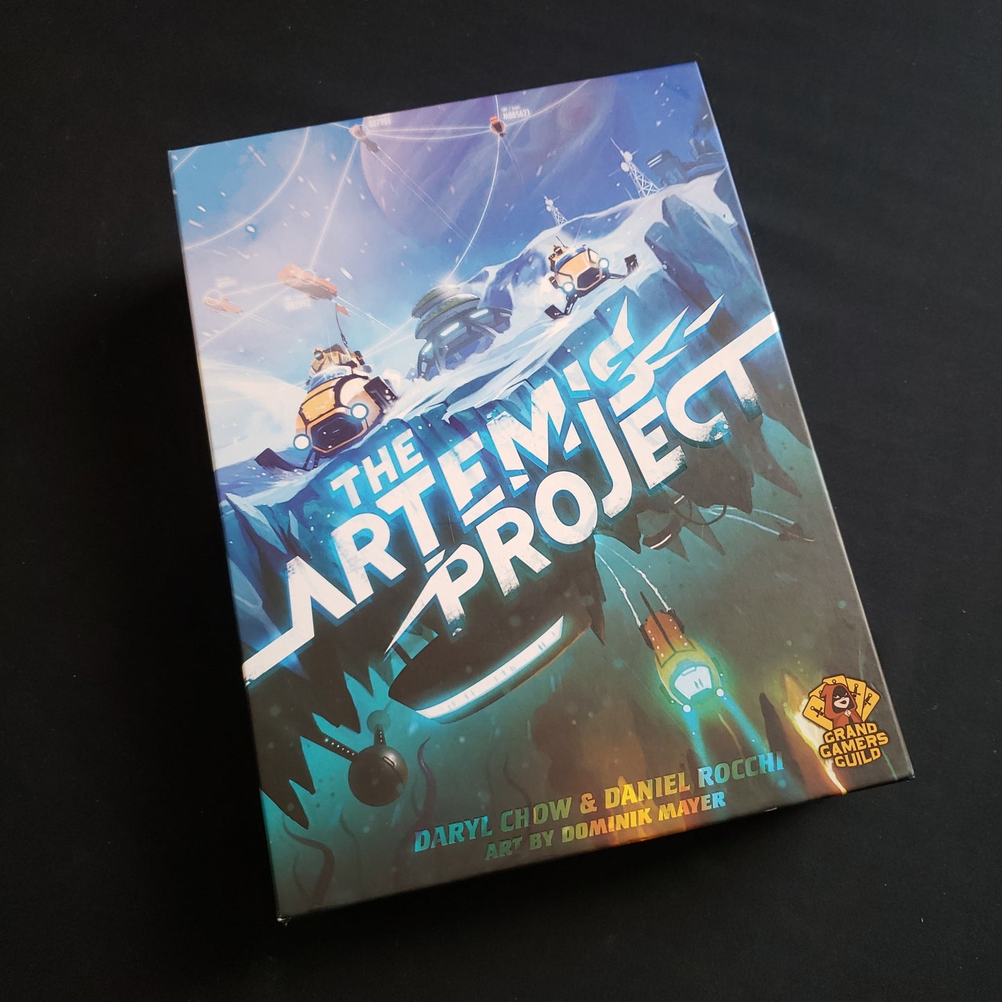 Image shows the front cover of the box of the Artemis Project board game