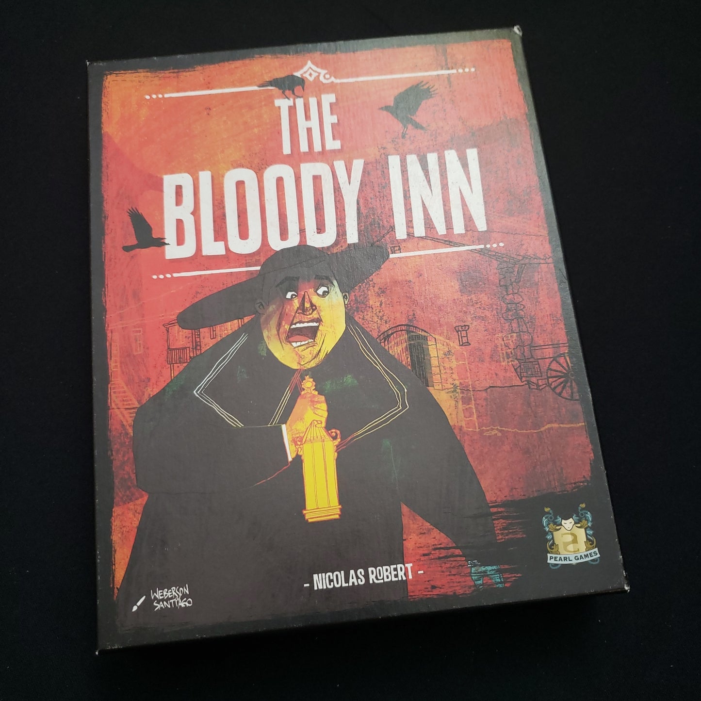Image shows the front cover of the box of the Bloody Inn card game