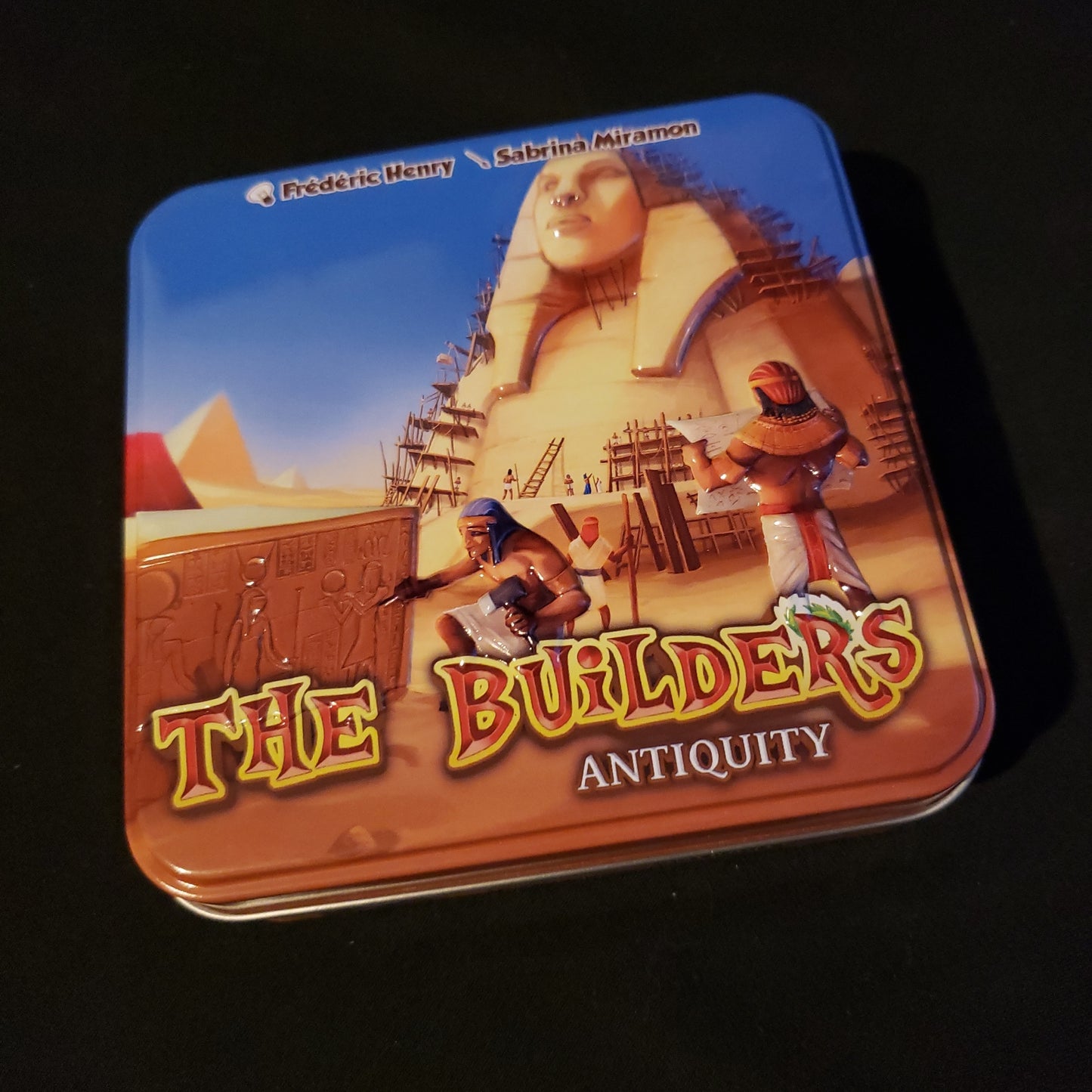 Image shows the front cover of the box of the Builders: Antiquity card game