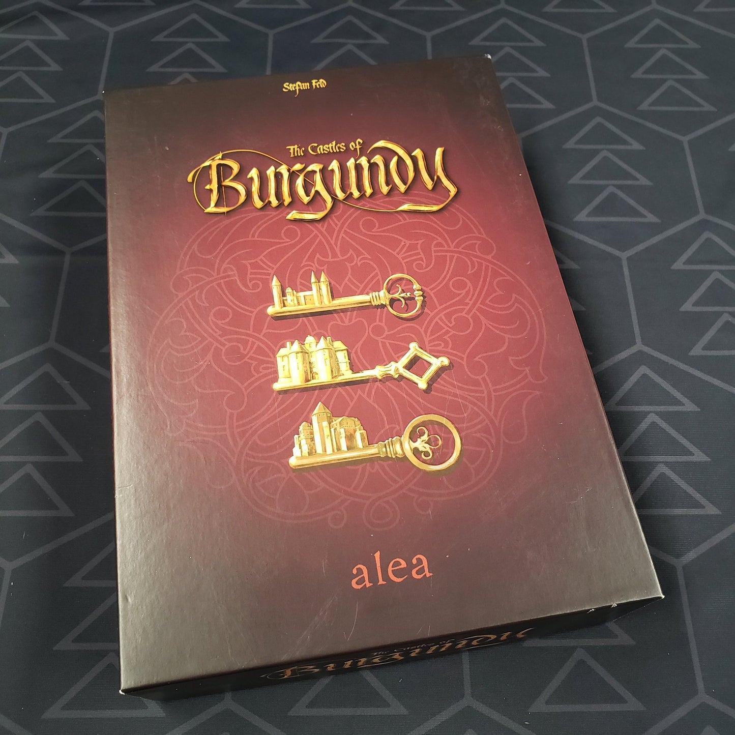 Image shows the front cover of the box of the anniversary edition of the Castles of Burgundy board game