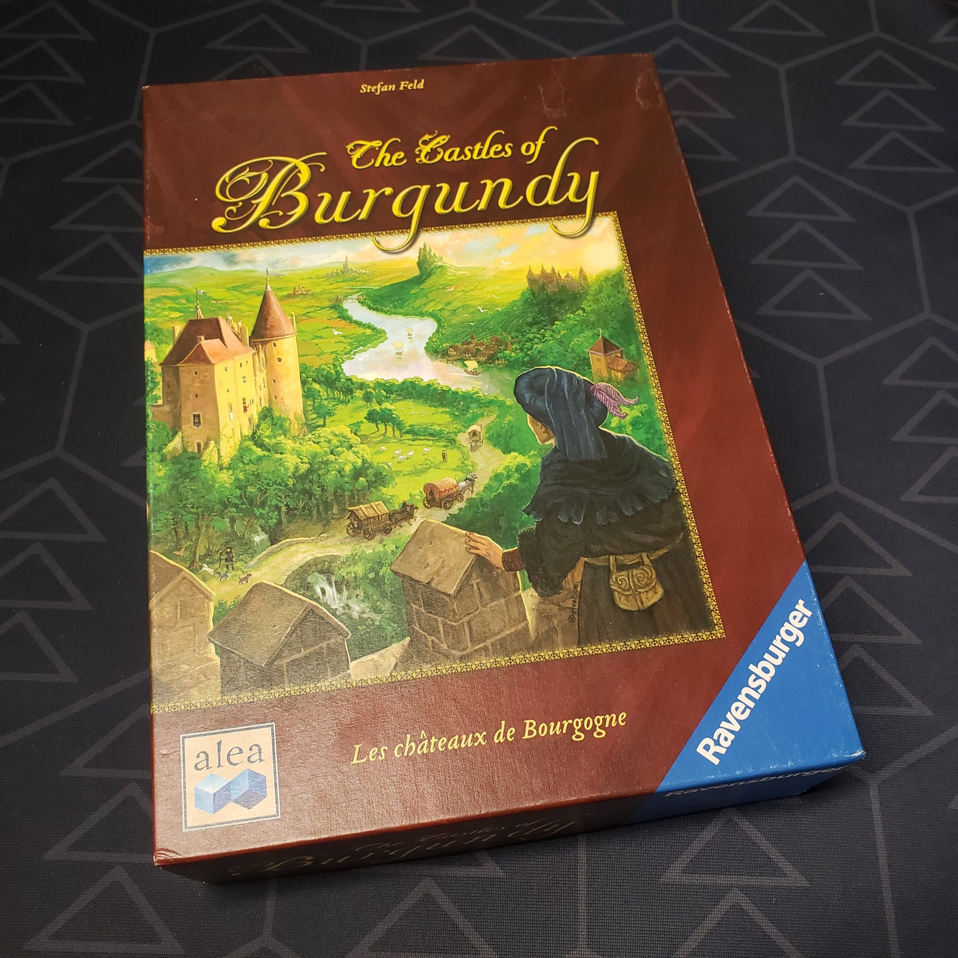 Image shows the front cover of the box of the Castles of Burgundy board game