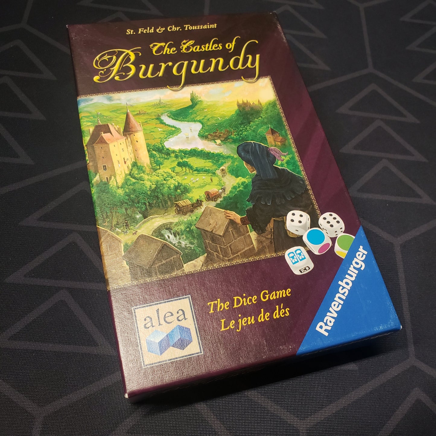 Image shows the front cover of the box for The Castles of Burgundy: The Dice Game