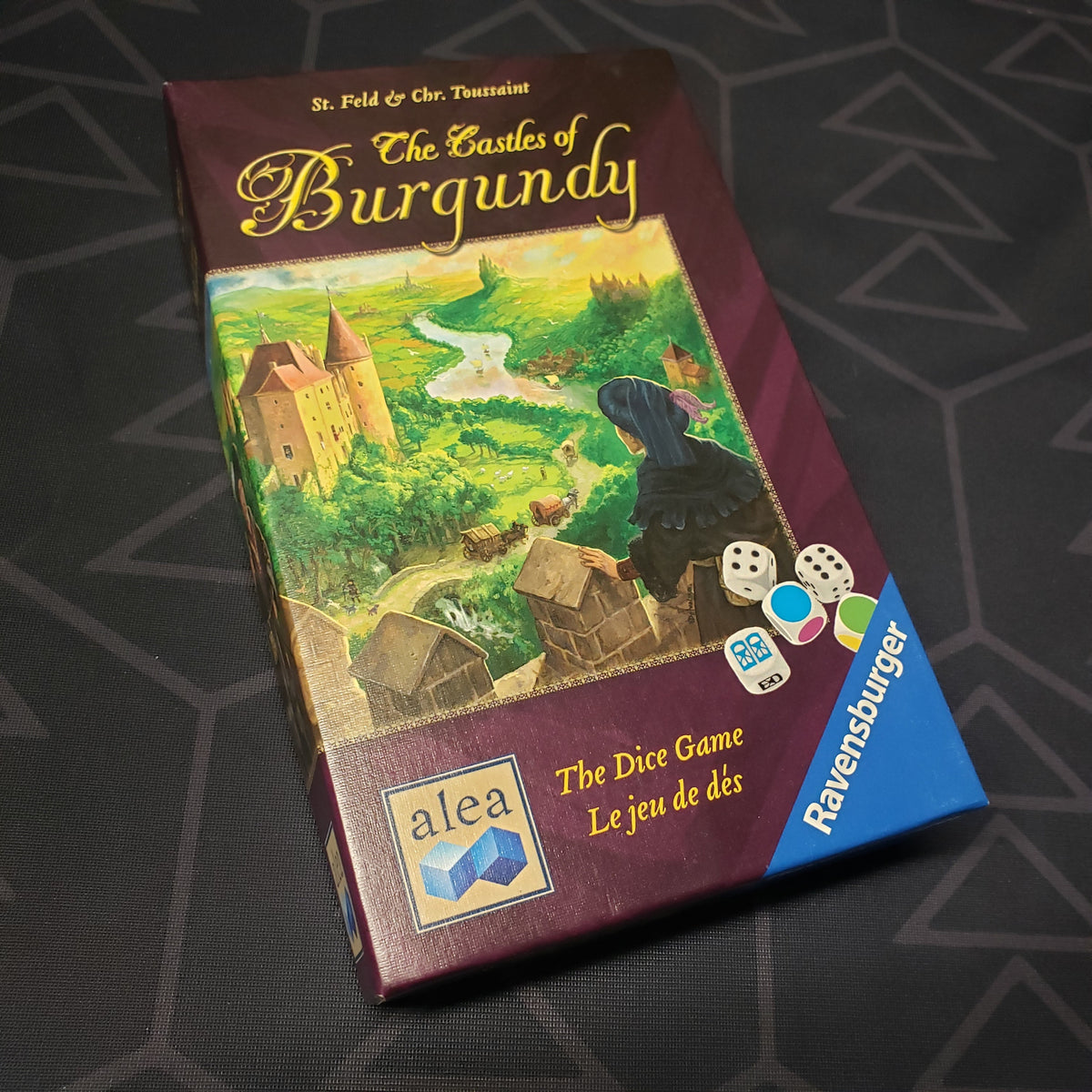 Image shows the front cover of the box for The Castles of Burgundy: The Dice Game