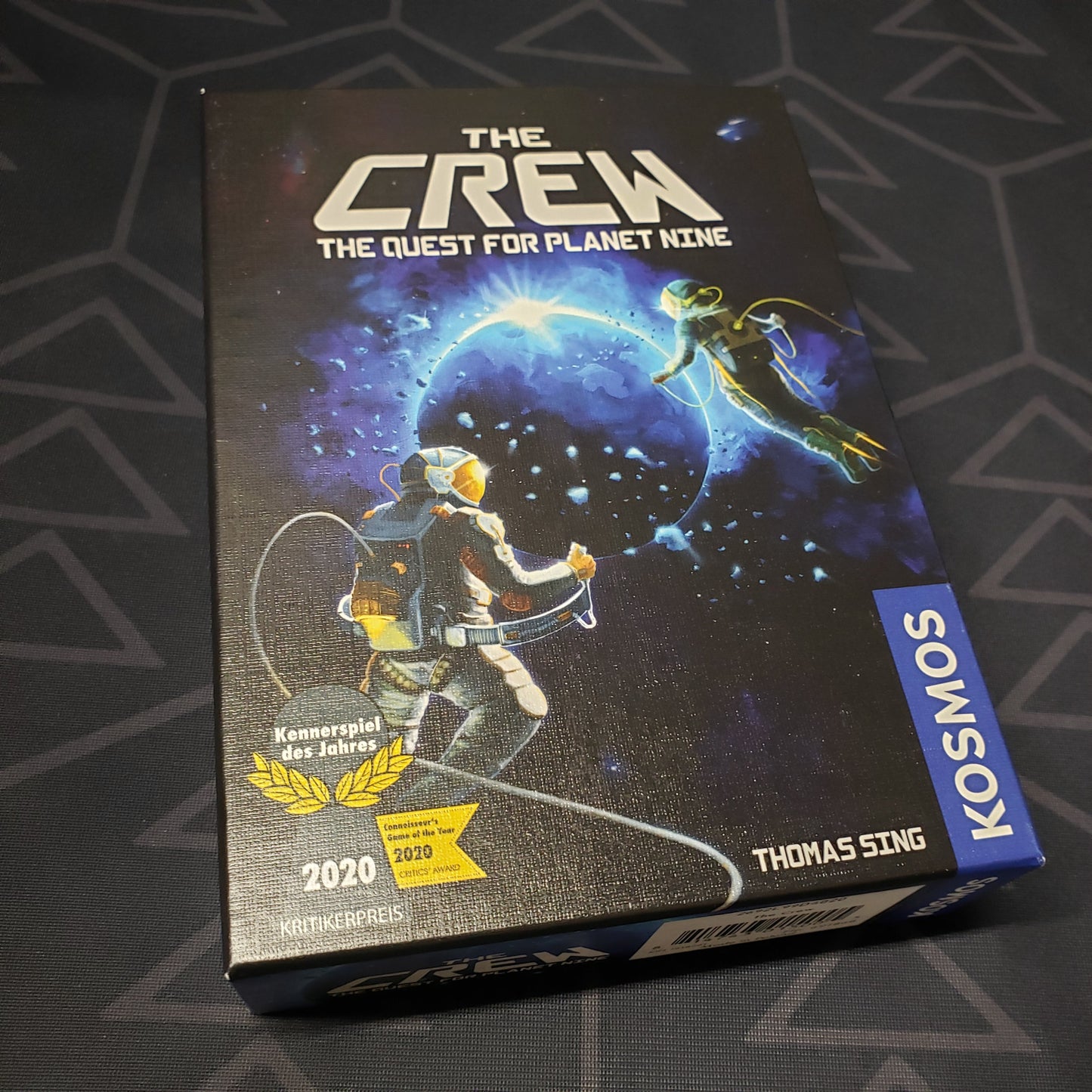 Image shows the front cover of the box of The Crew: The Quest for Planet Nine card game