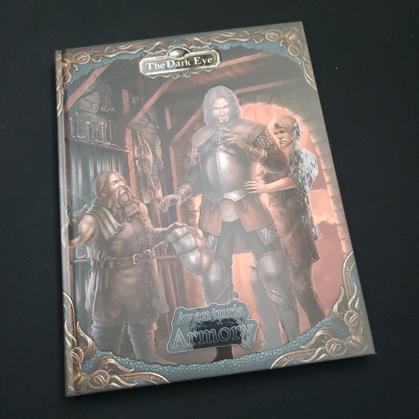 Image shows the front cover of the Aventuria Armory book for the Dark Eye roleplaying game