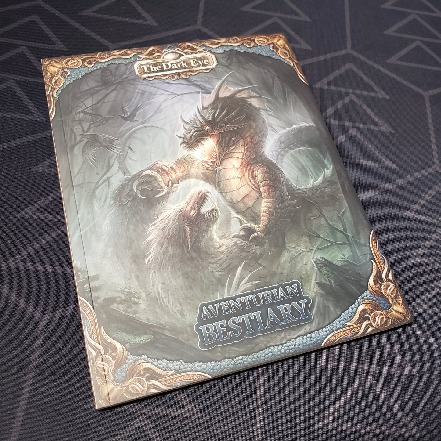 Image shows the front cover of the Aventurian Bestiary (Pocket Edition) book for the roleplaying game The Dark Eye
