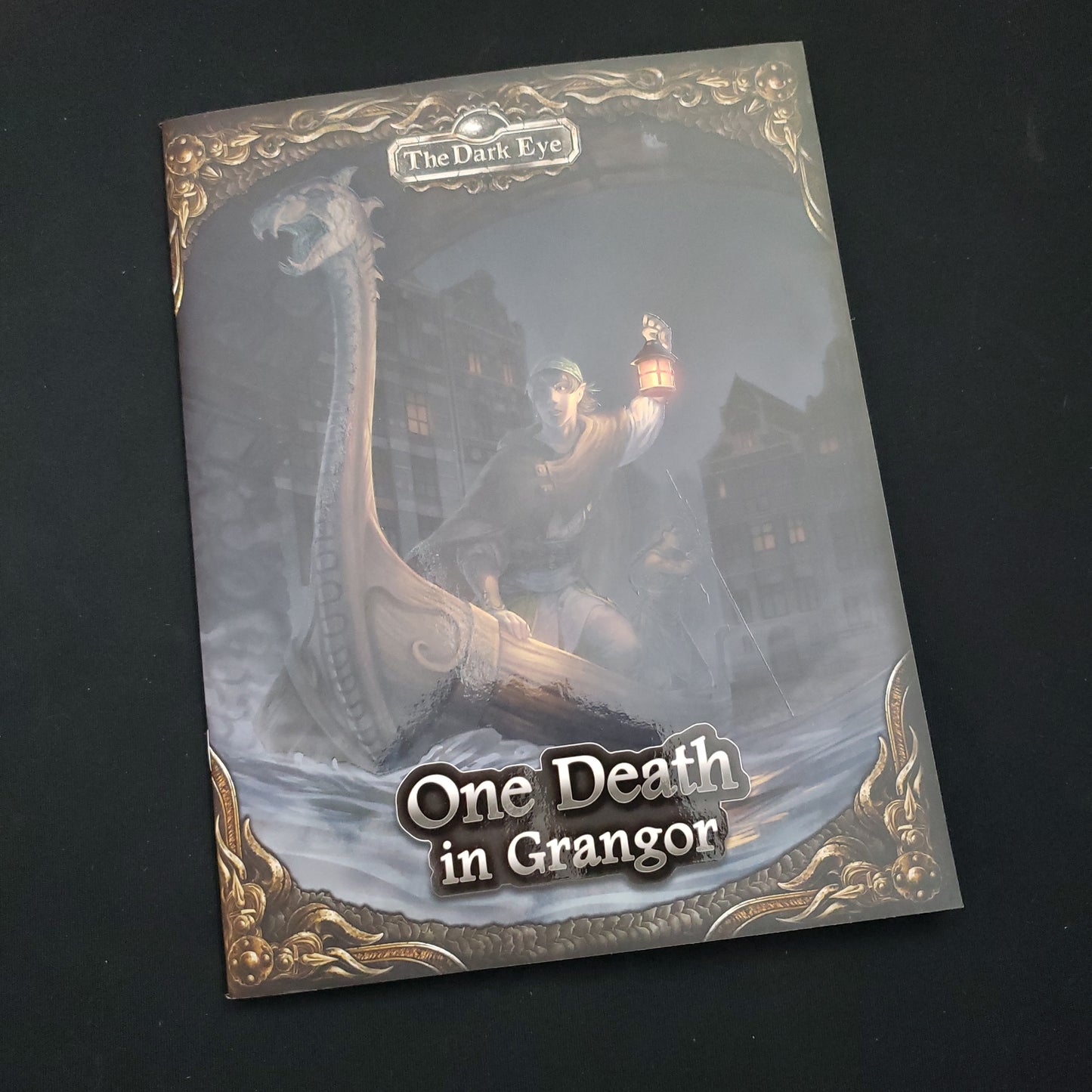 Image shows the front cover of the Dark Eye: One Death in Grangor roleplaying game book
