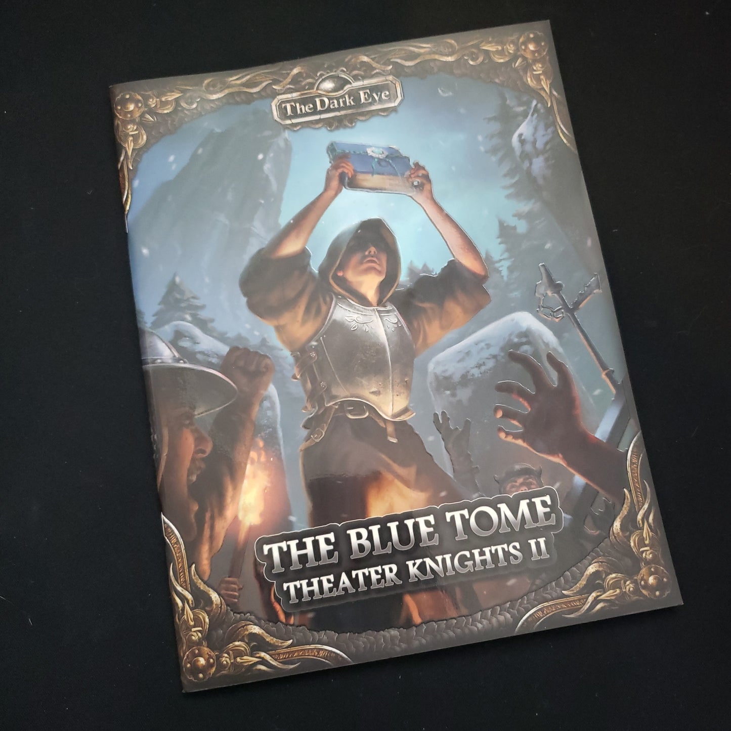 Image shows the front cover of the Theater Knights II: The Blue Tome book for the Dark Eye roleplaying game