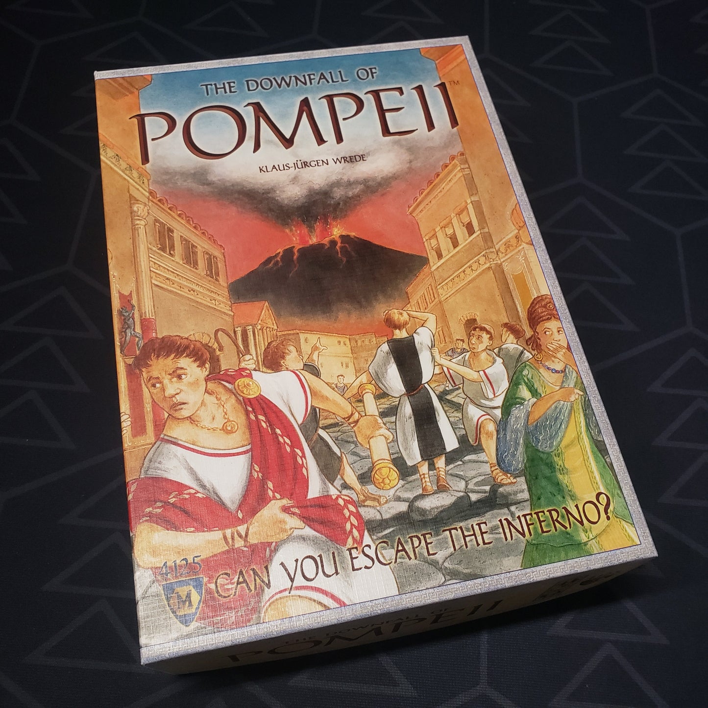 Image shows the front cover of the box for the Downfall of Pompeii board game