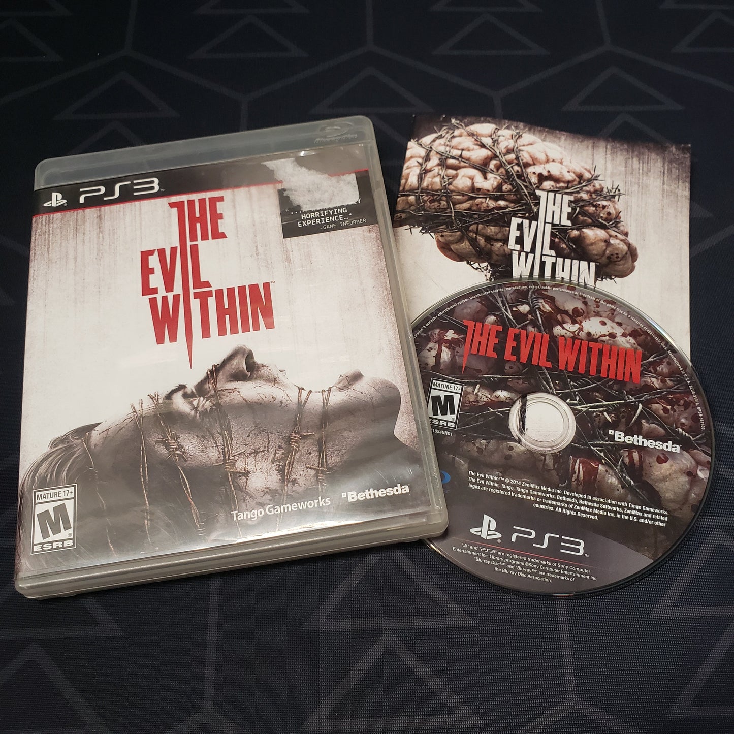 Image shows the case, manual & disc for the video game The Evil Within for Playstation 3