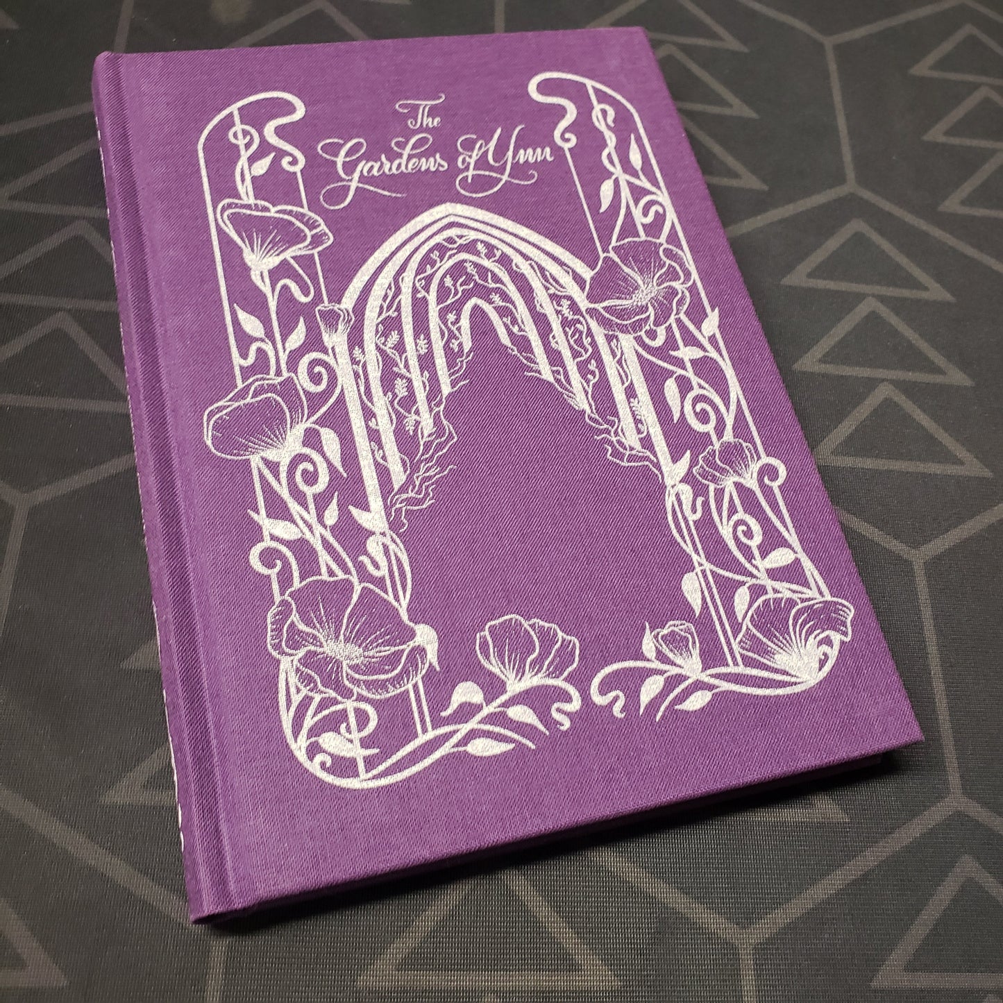 Image shows the front cover of the Gardens of Ynn roleplaying game book